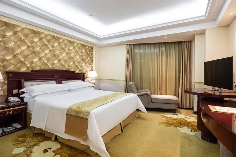 Bed in Vienna International Hotel Taicang Wanda Square