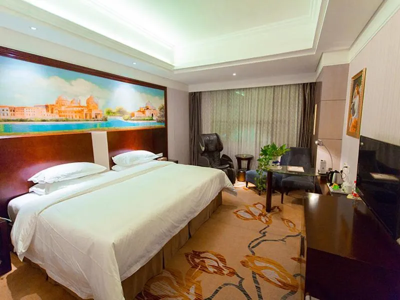 Bed in Vienna International Hotel Zhangjiajie Tianmen Mountain