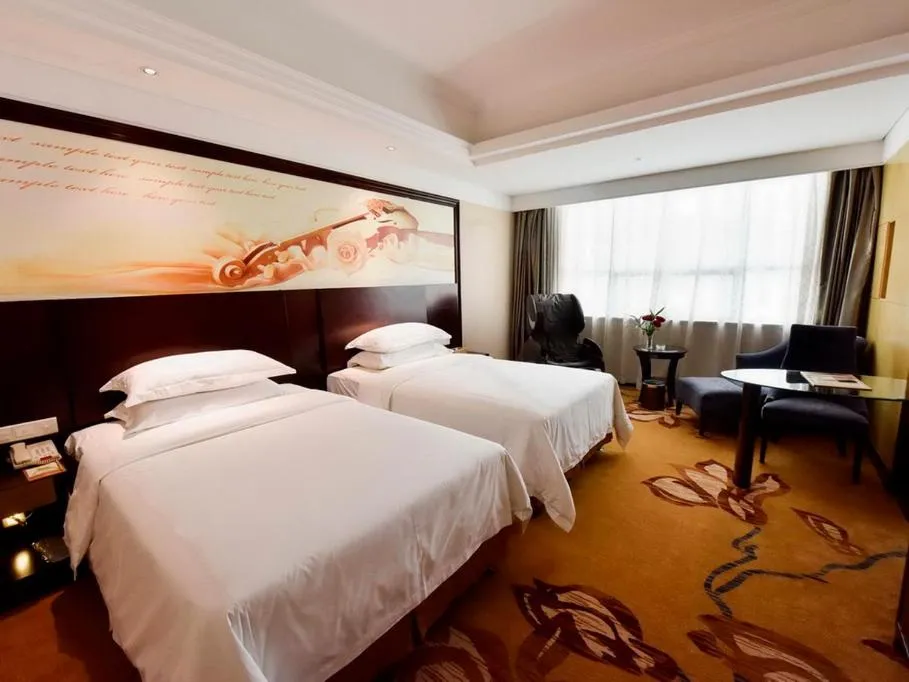 Bed in Vienna International Hotel Zhangjiajie Tianmen Mountain