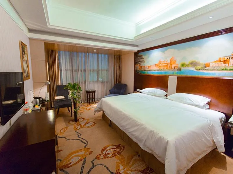 Bed in Vienna International Hotel Zhangjiajie Tianmen Mountain