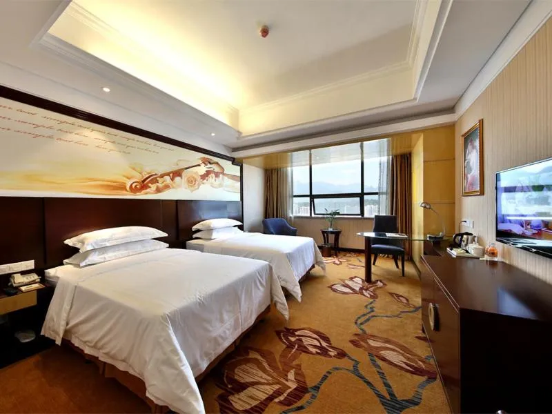 Bed in Vienna International Hotel Zhangjiajie Tianmen Mountain