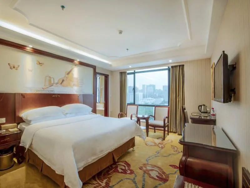 Bed in Vienna International Hotel Jieyang Jieyanglou