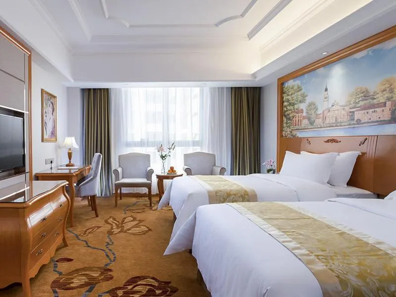 Bed in Vienna International Hotel Changsha Shumuling Subway Station