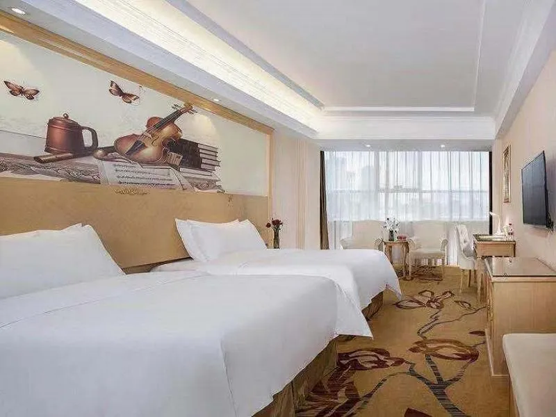 Bed in Vienna Hotel Huizhou Railway Station