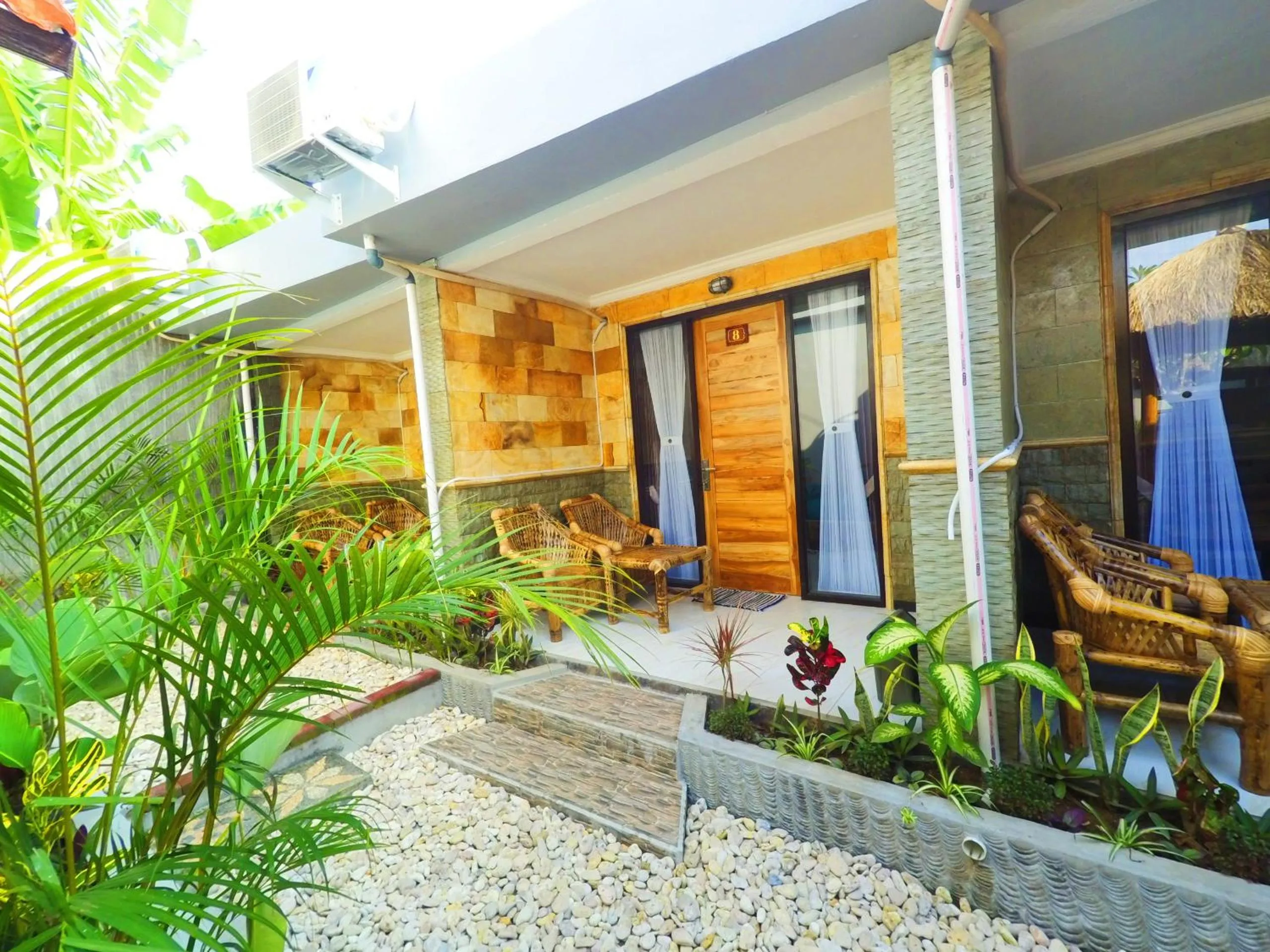 Bedroom in Tropical Garden Inn