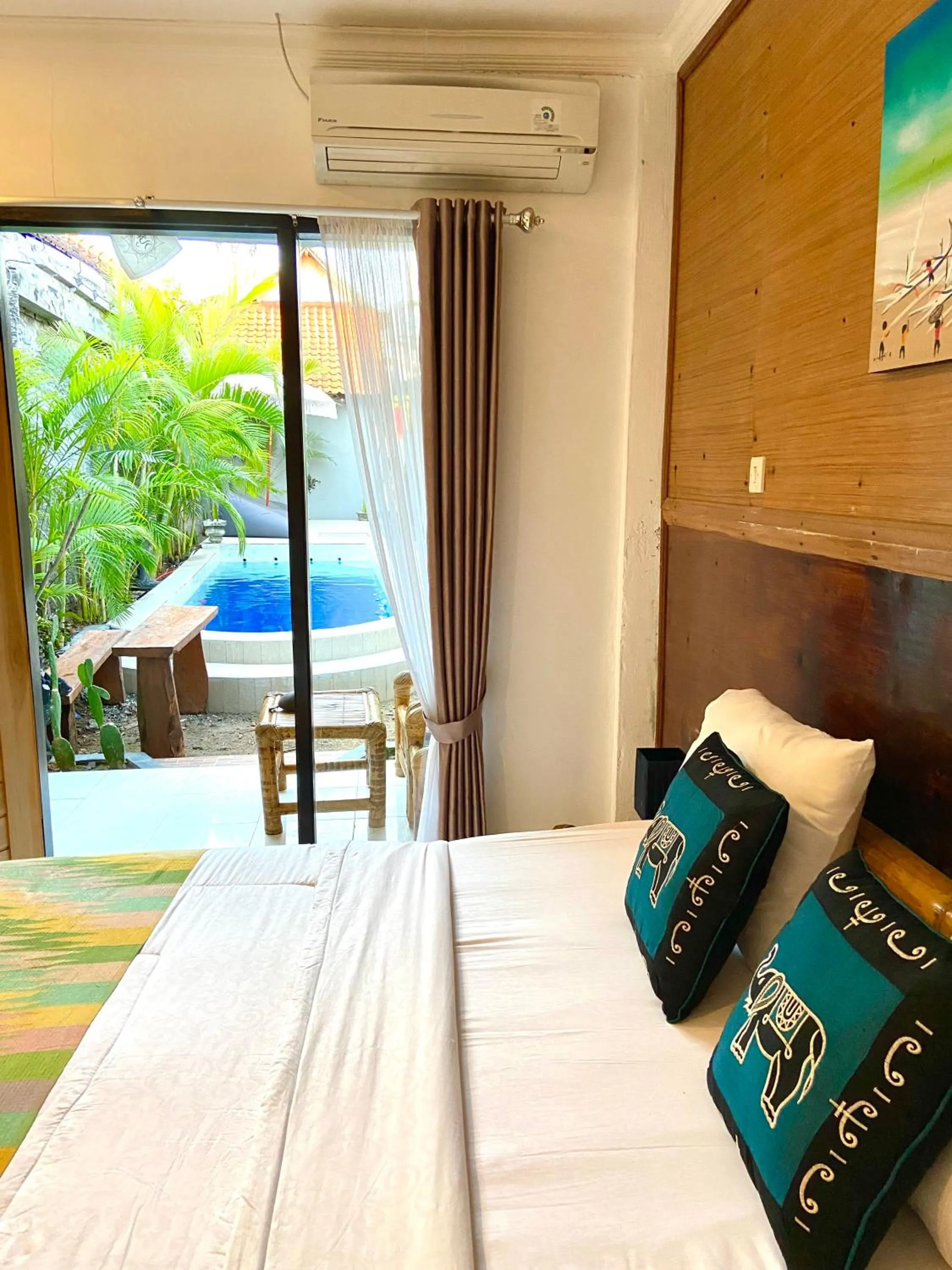 Bed in Tropical Garden Inn