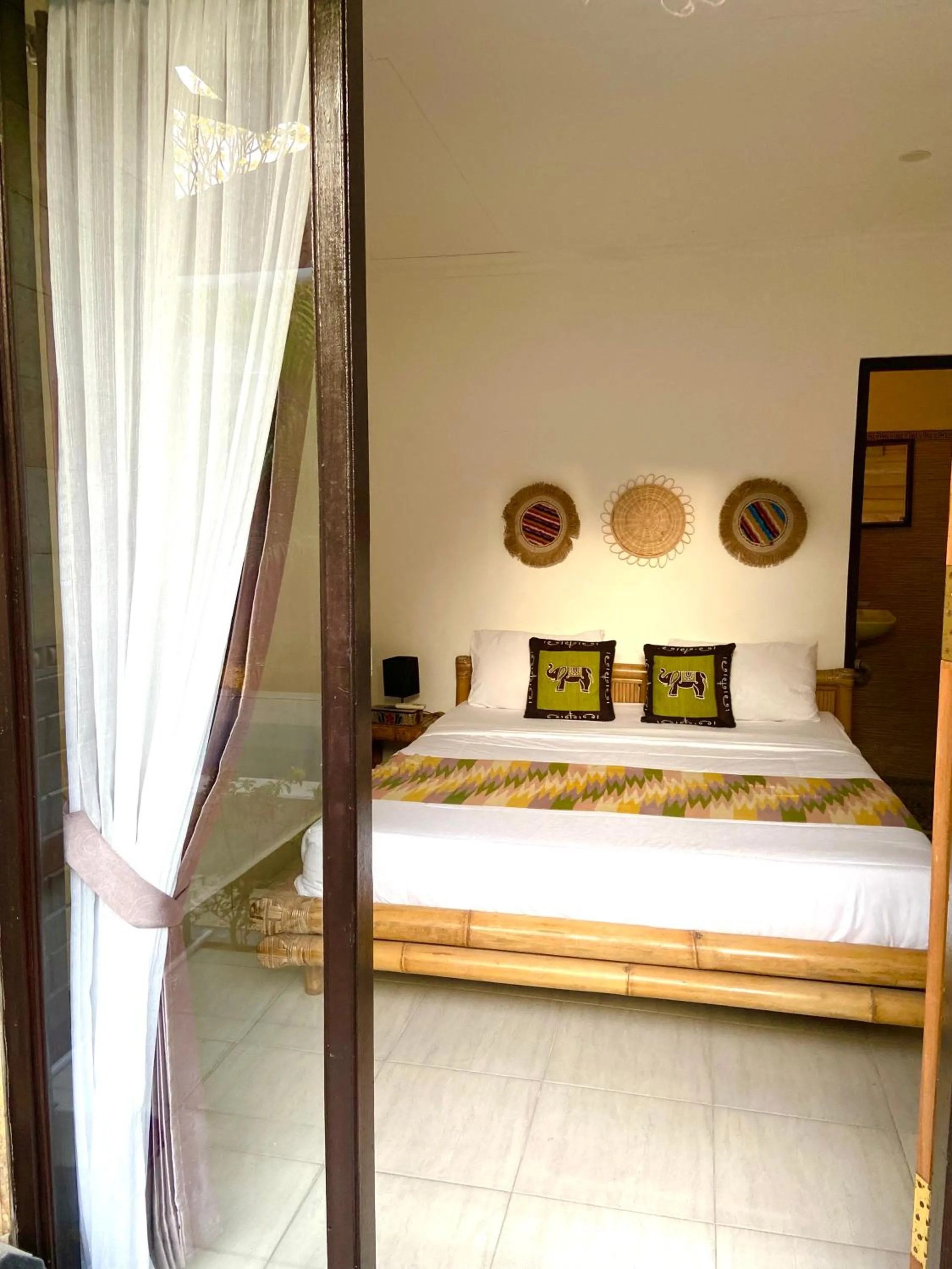Bed in Tropical Garden Inn