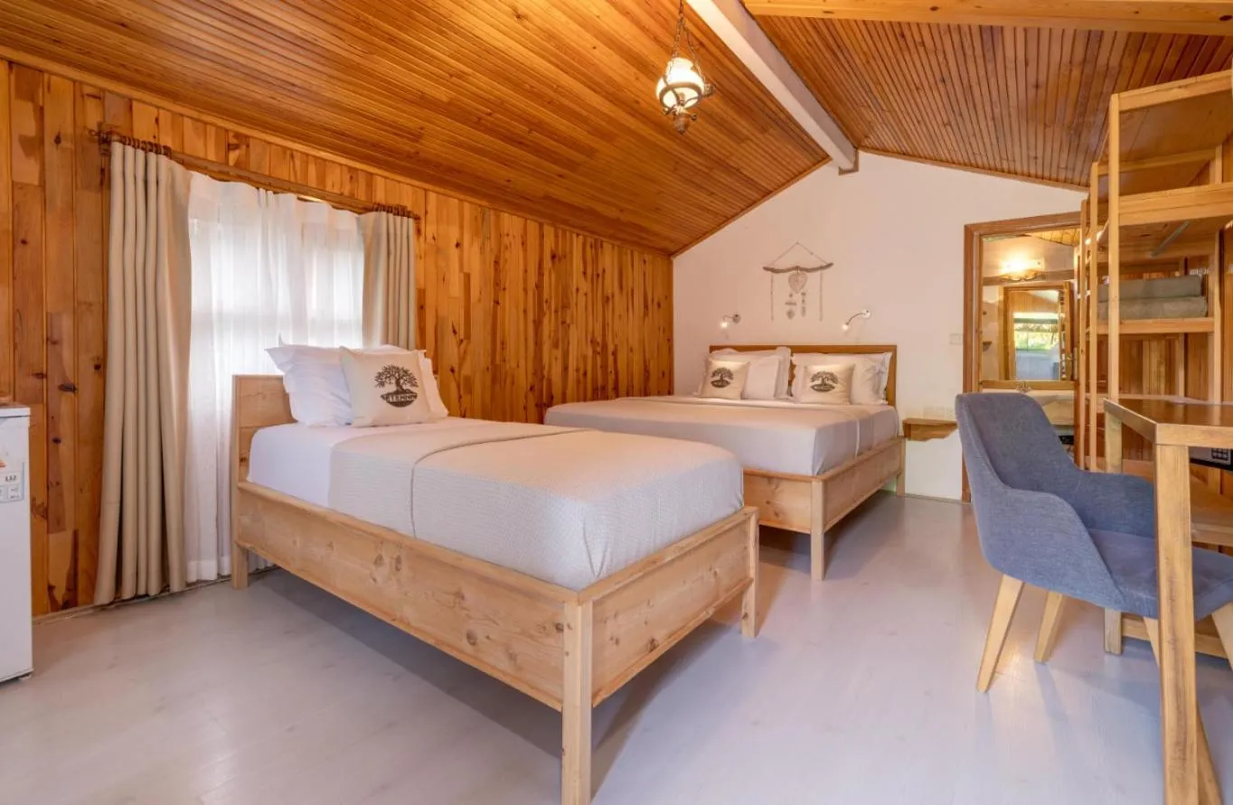 Bed in Etenna Beach Bungalows
