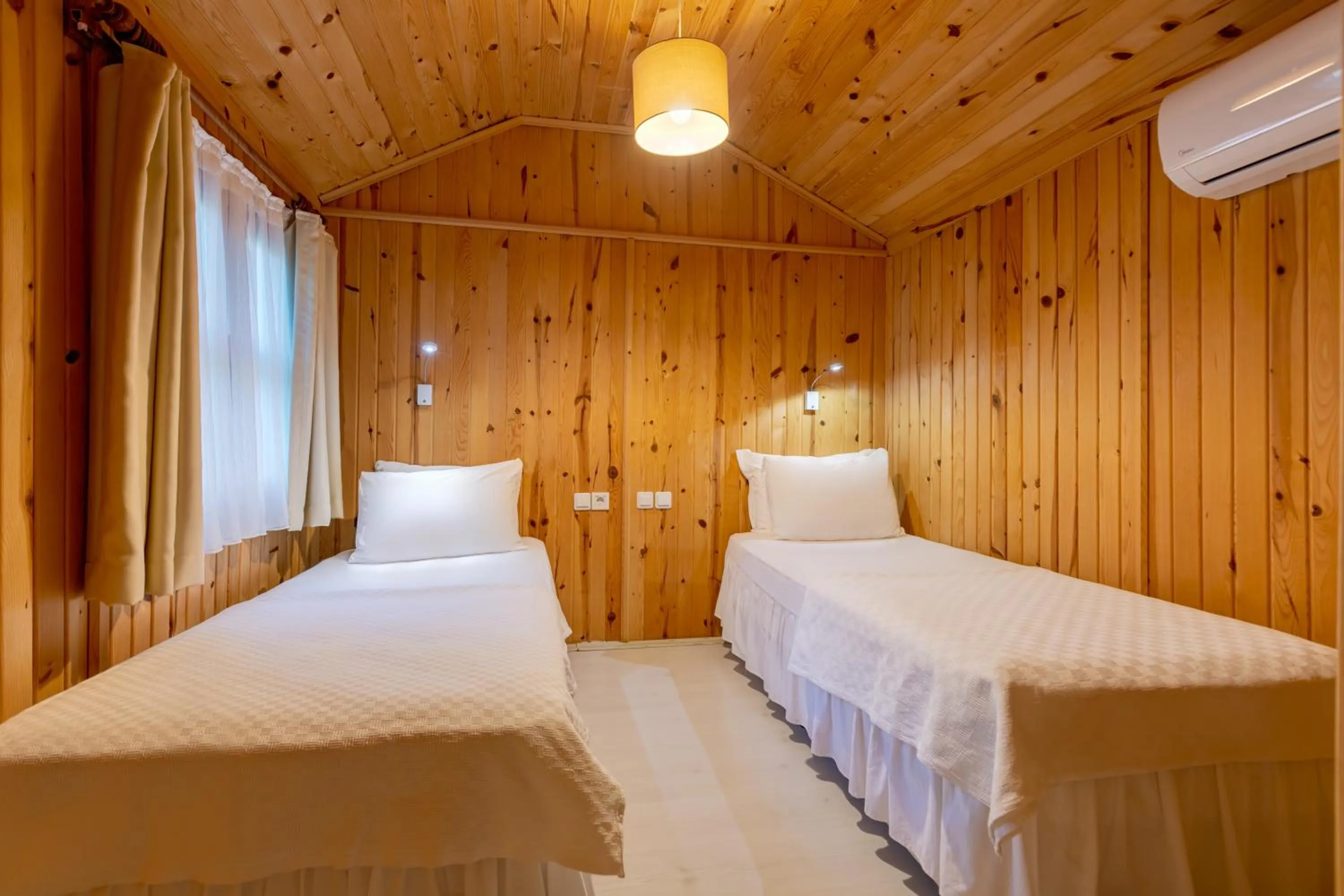 Bed in Etenna Beach Bungalows