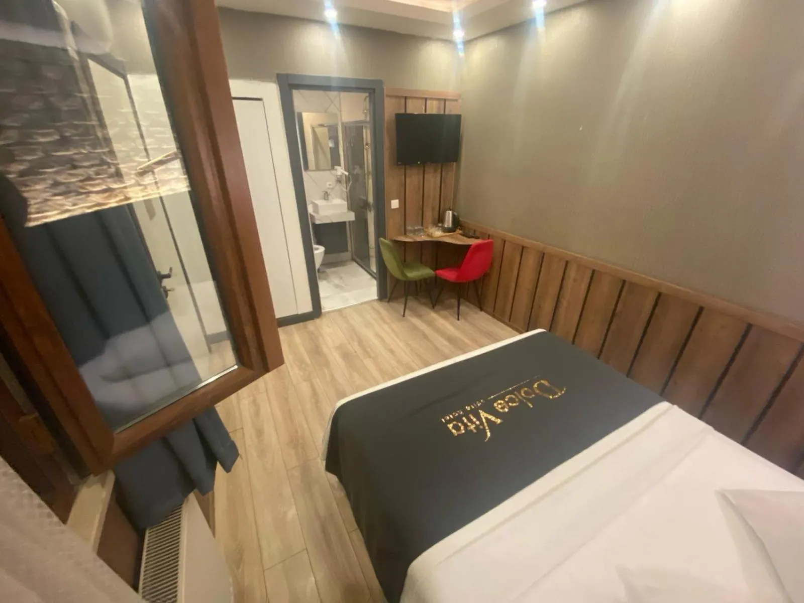 Bed in Dolce Vita Suite Hotel