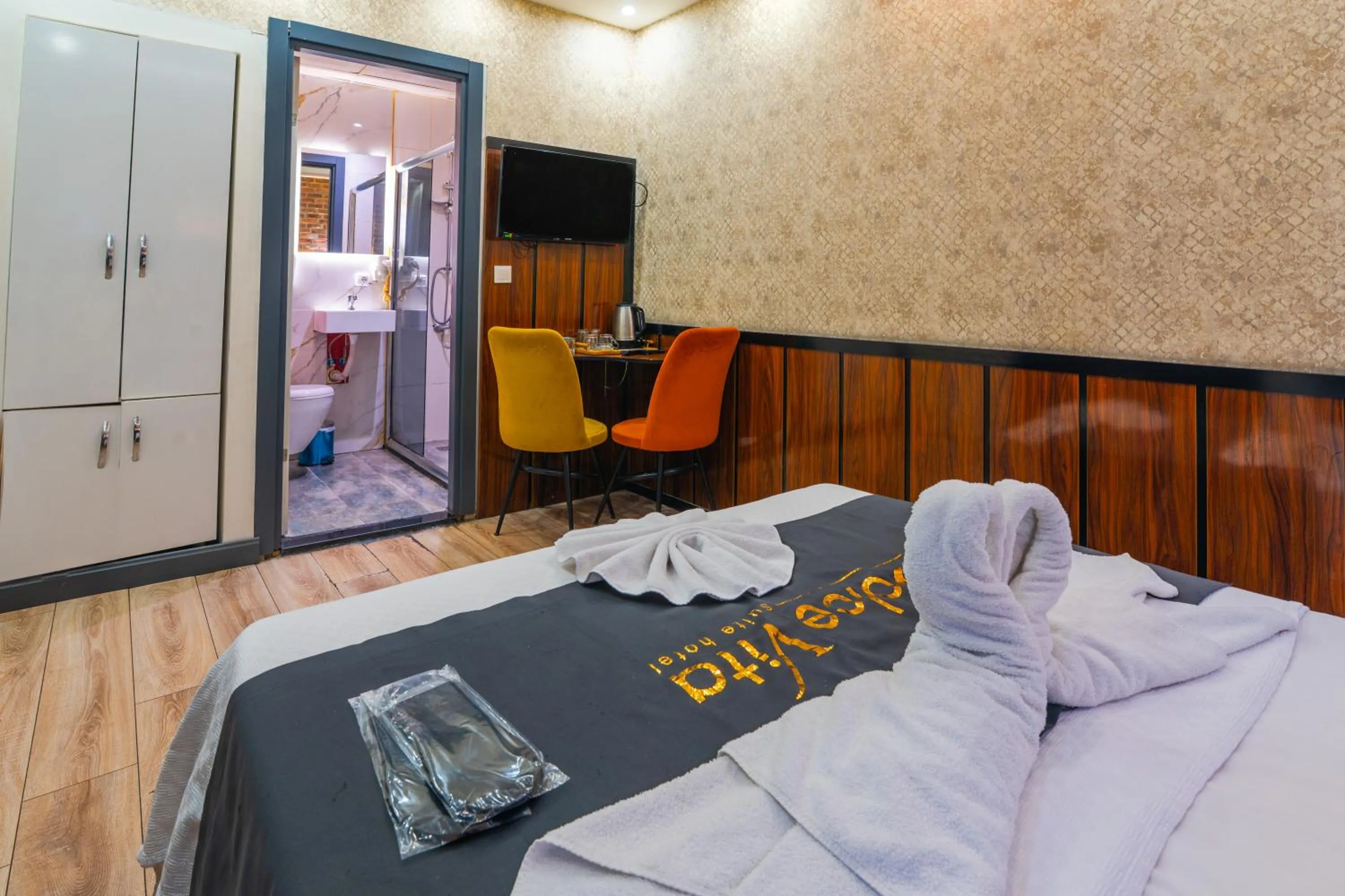 Bed in Dolce Vita Suite Hotel