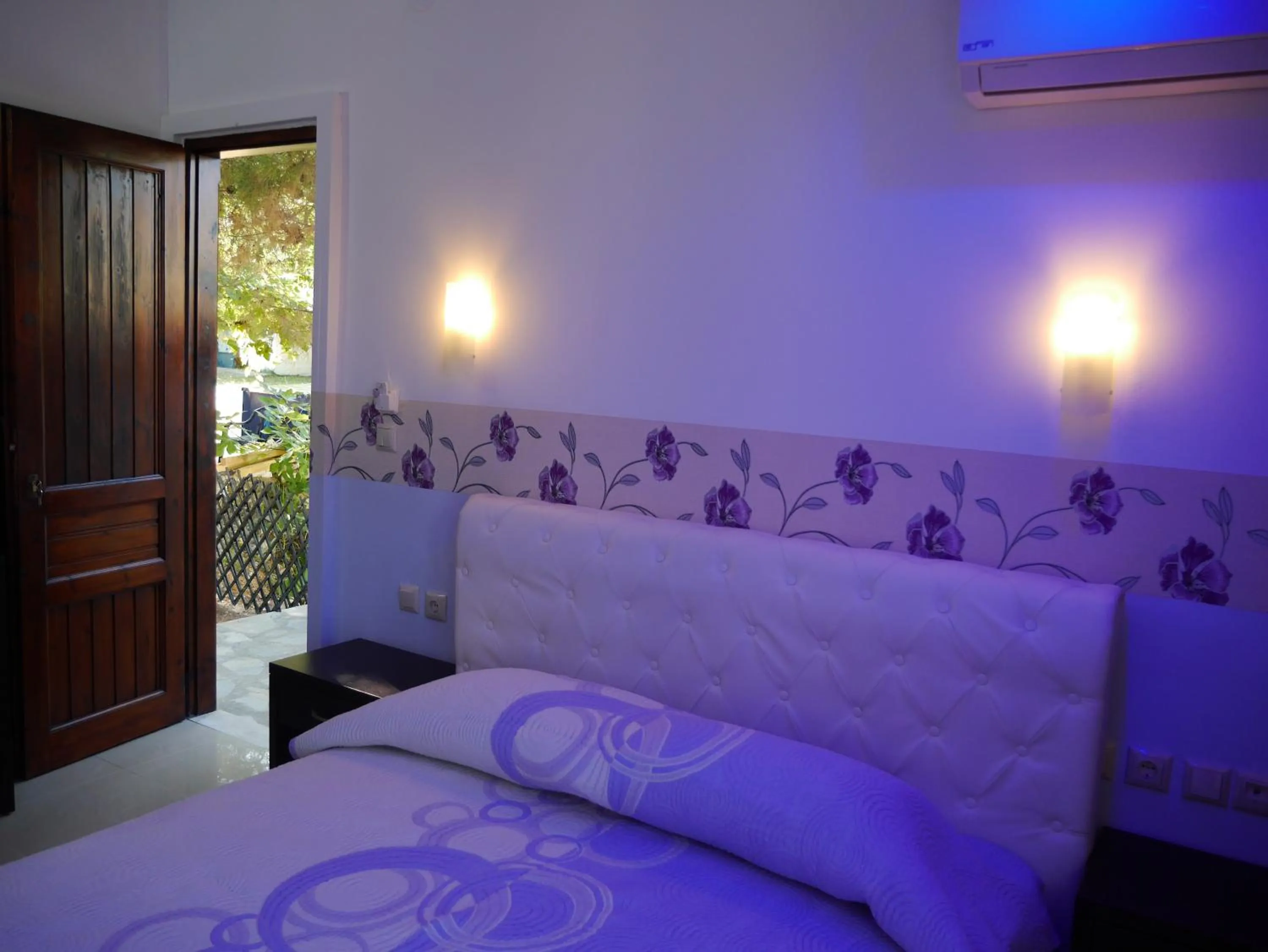 Bed in Blue Bay Beach Hotel