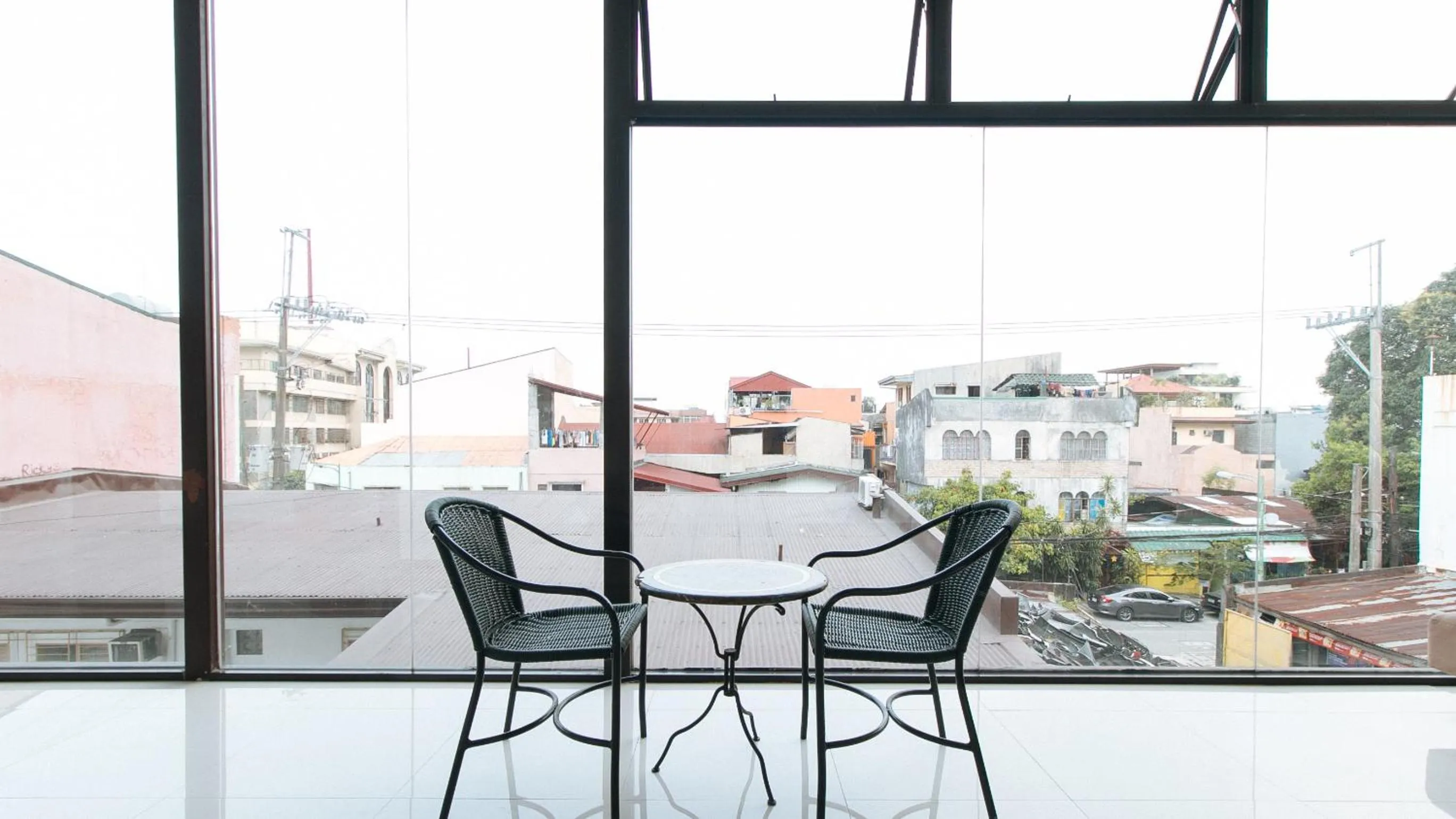 Seating area in RedDoorz at San Antonio Makati