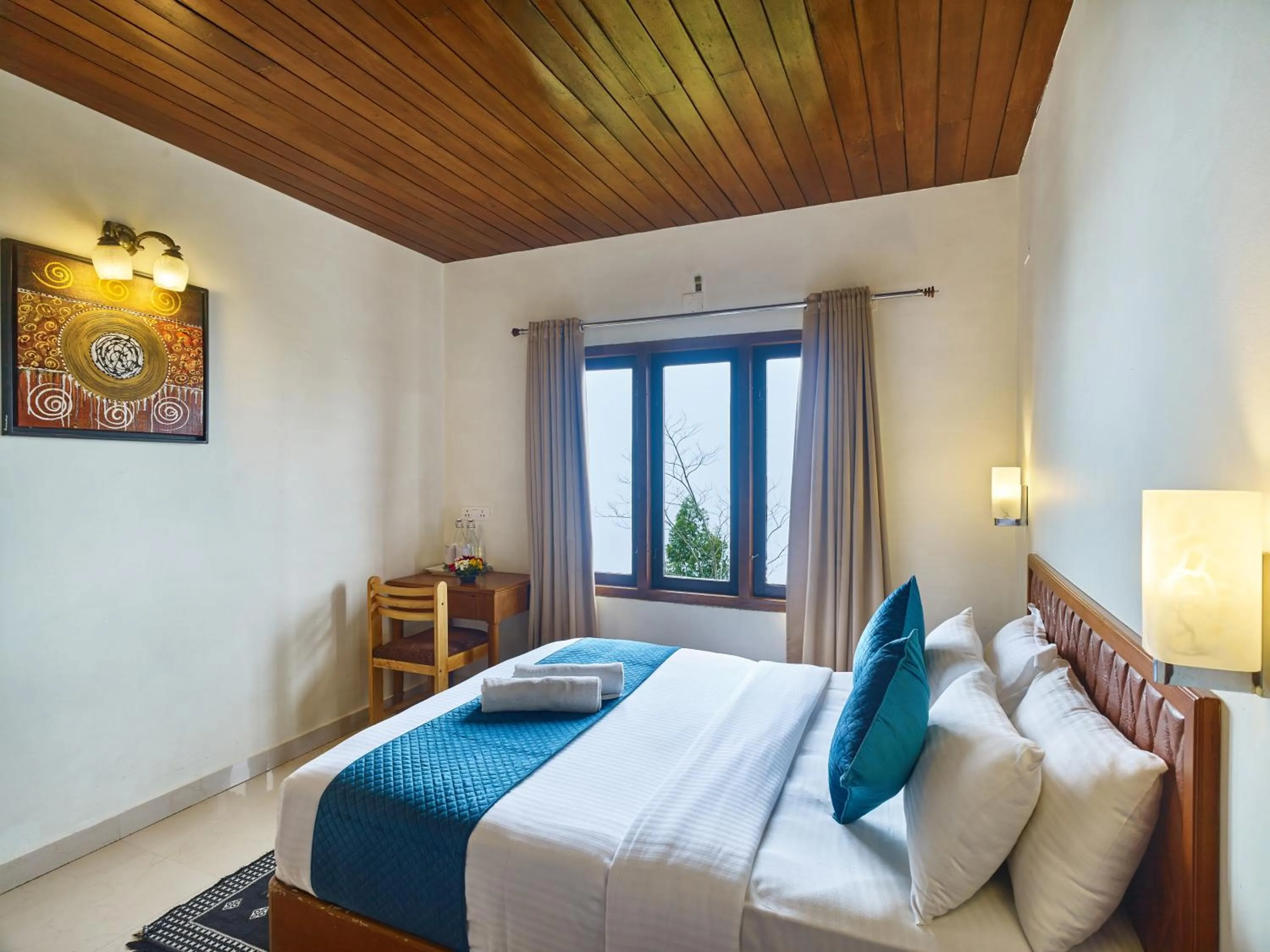 Bed in Deshadan Mountain Resort -The highest resort in Munnar