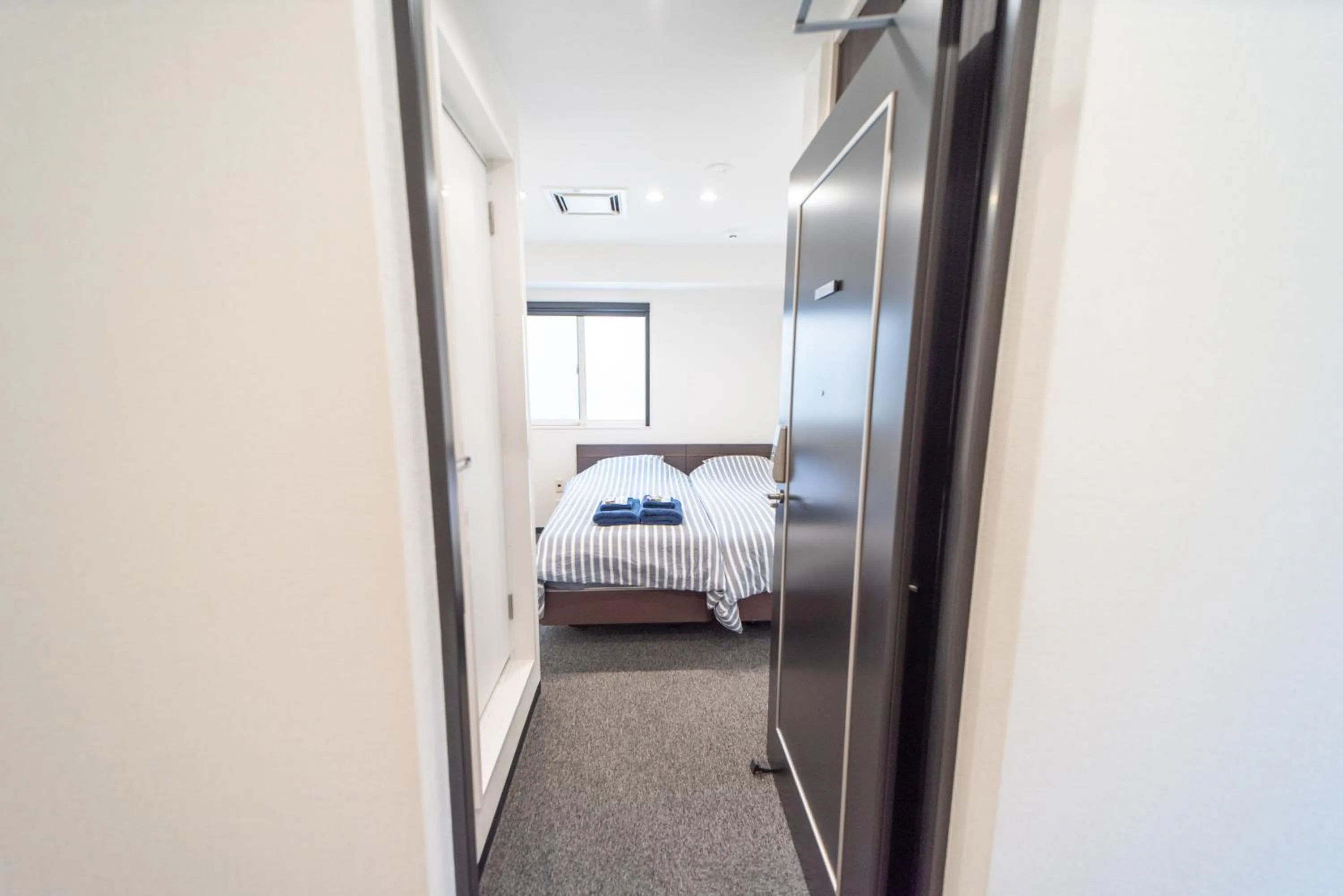 Photo of the whole room, Bed in Port House Shibuya