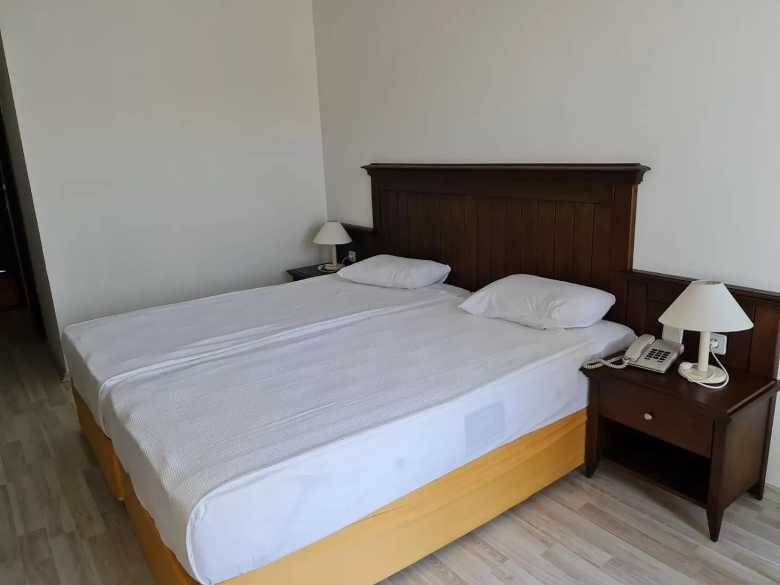 Bed in Side Palm D'or Hotel