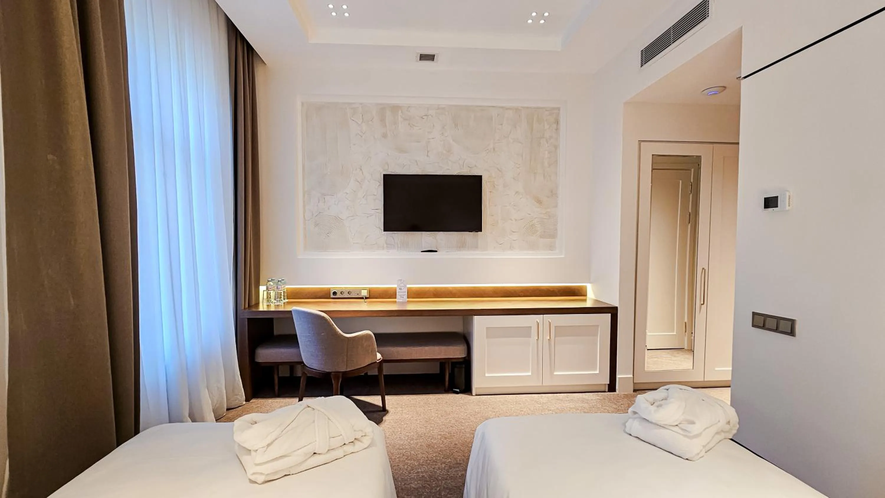 Bed in Grand Tien Shan Hotel