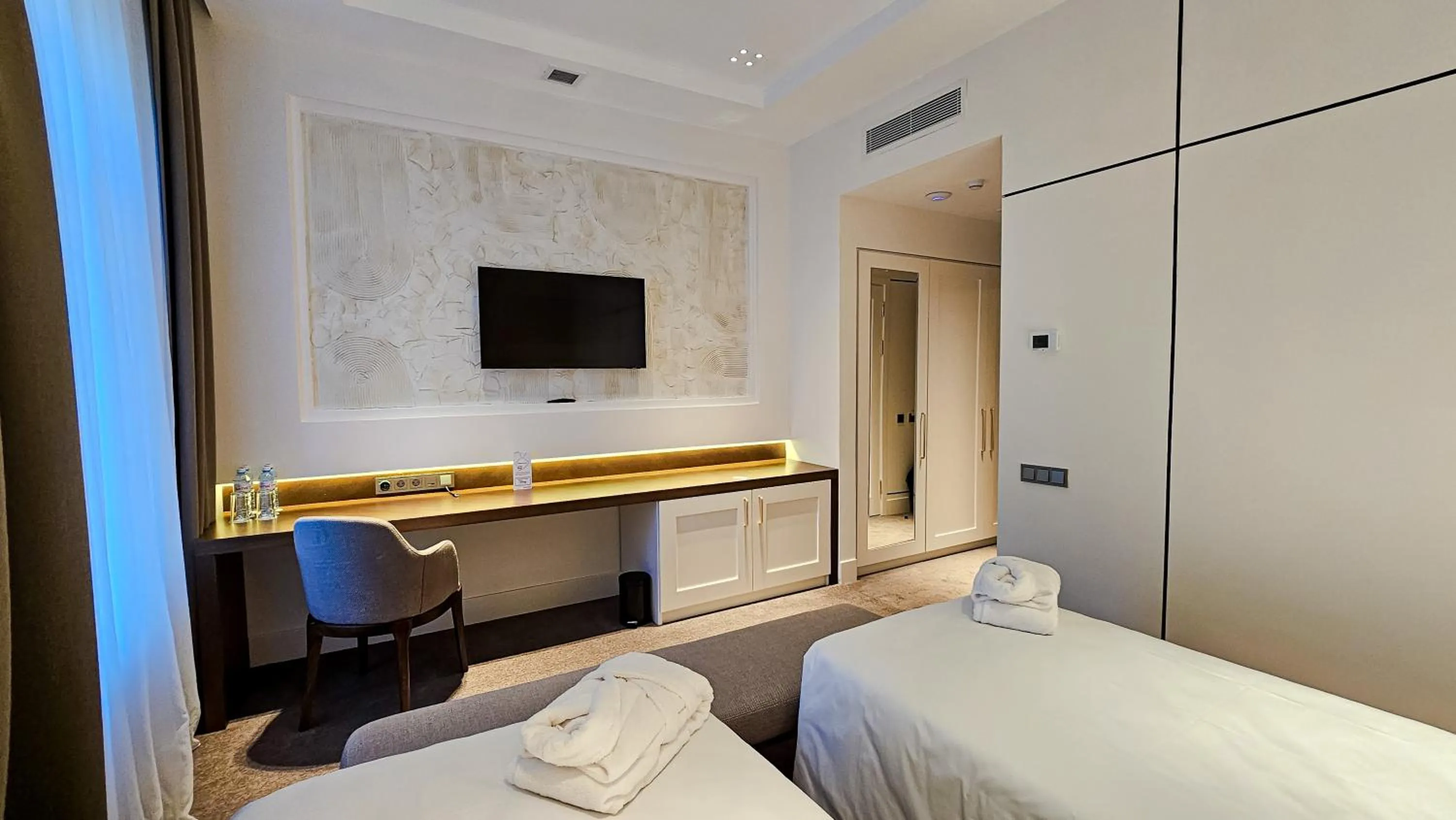 Bed in Grand Tien Shan Hotel