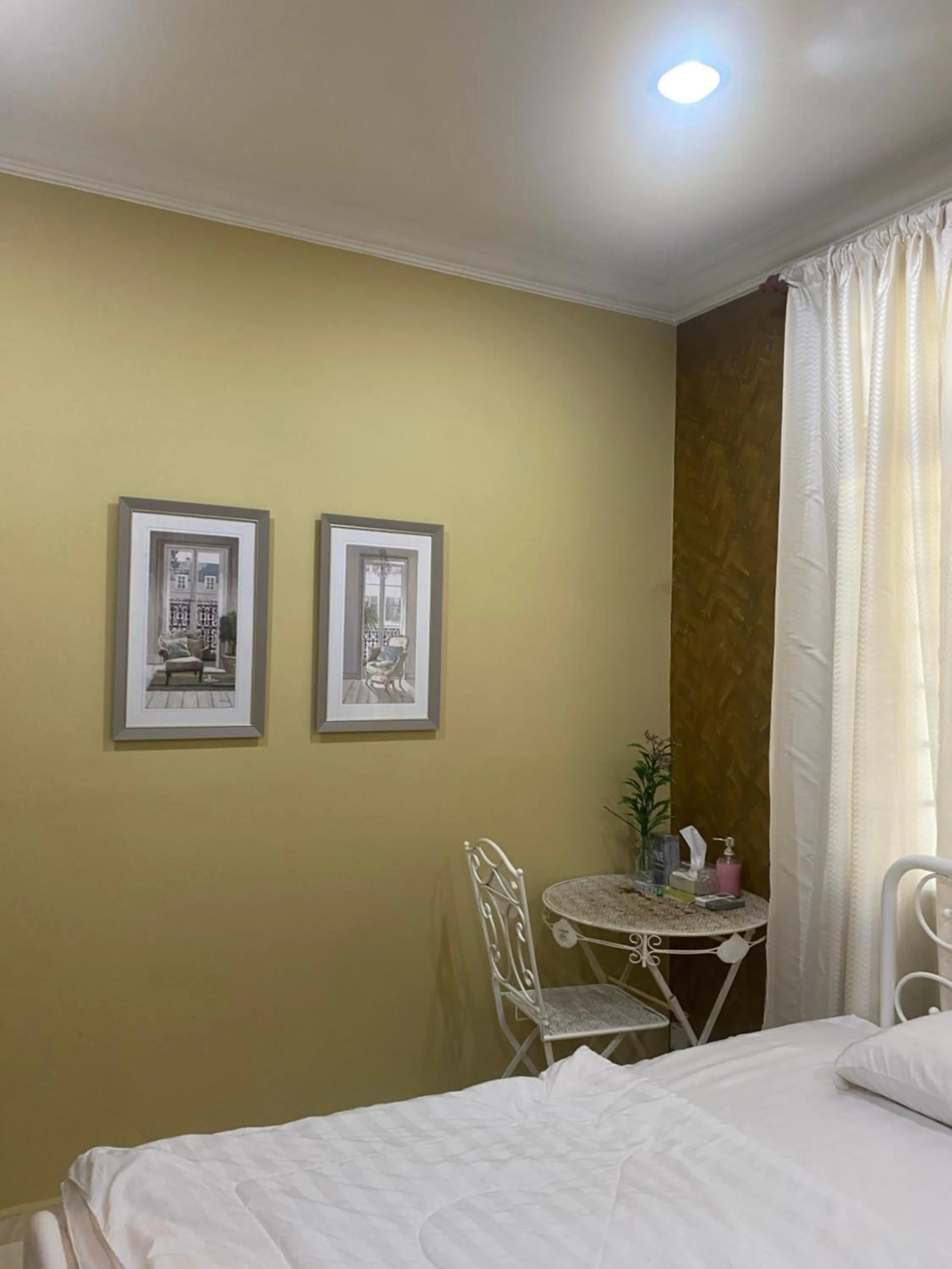 Seating area, Bed in AAM Hotel