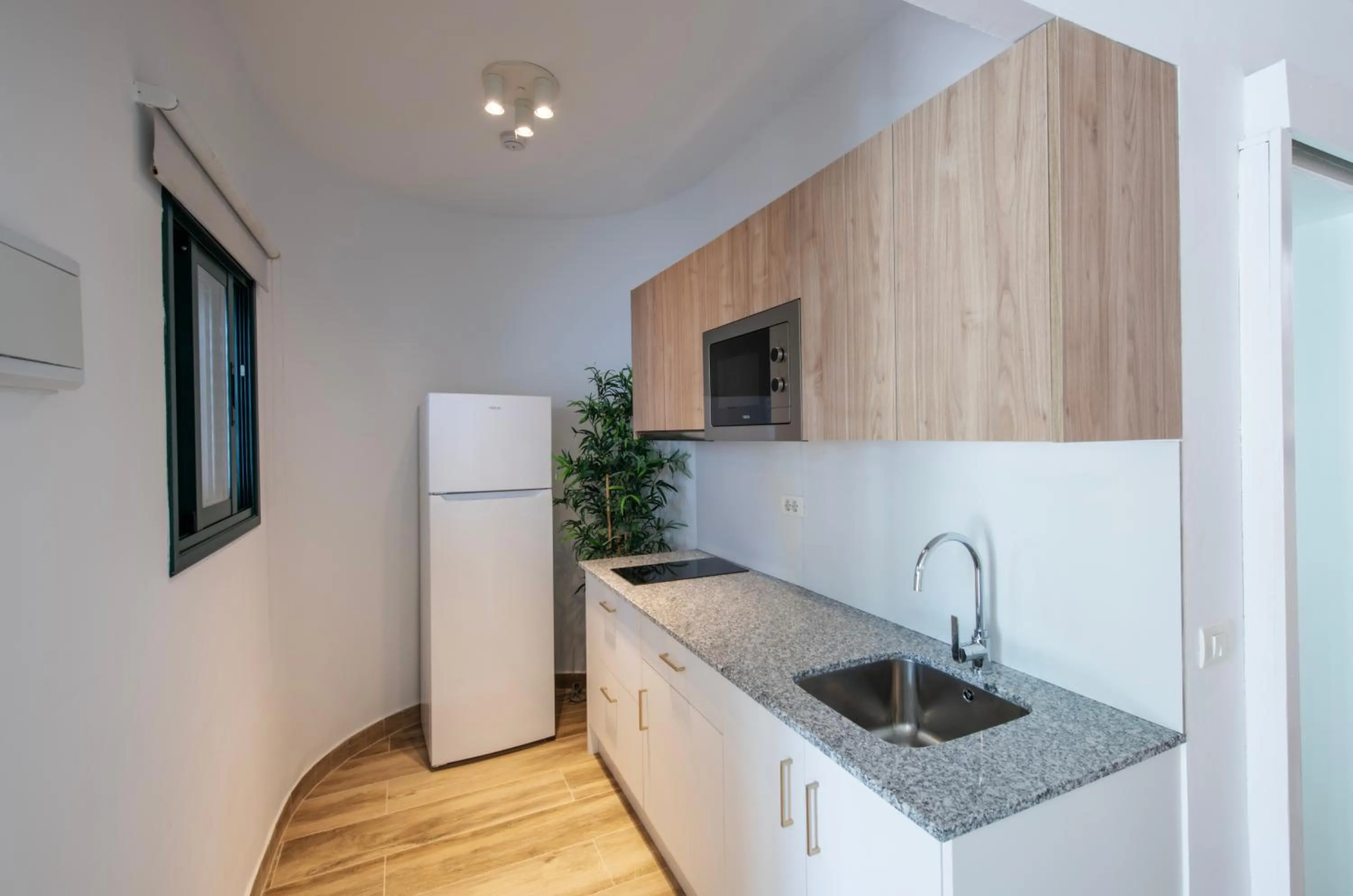 Kitchen or kitchenette in Apartamentos Los Rosales