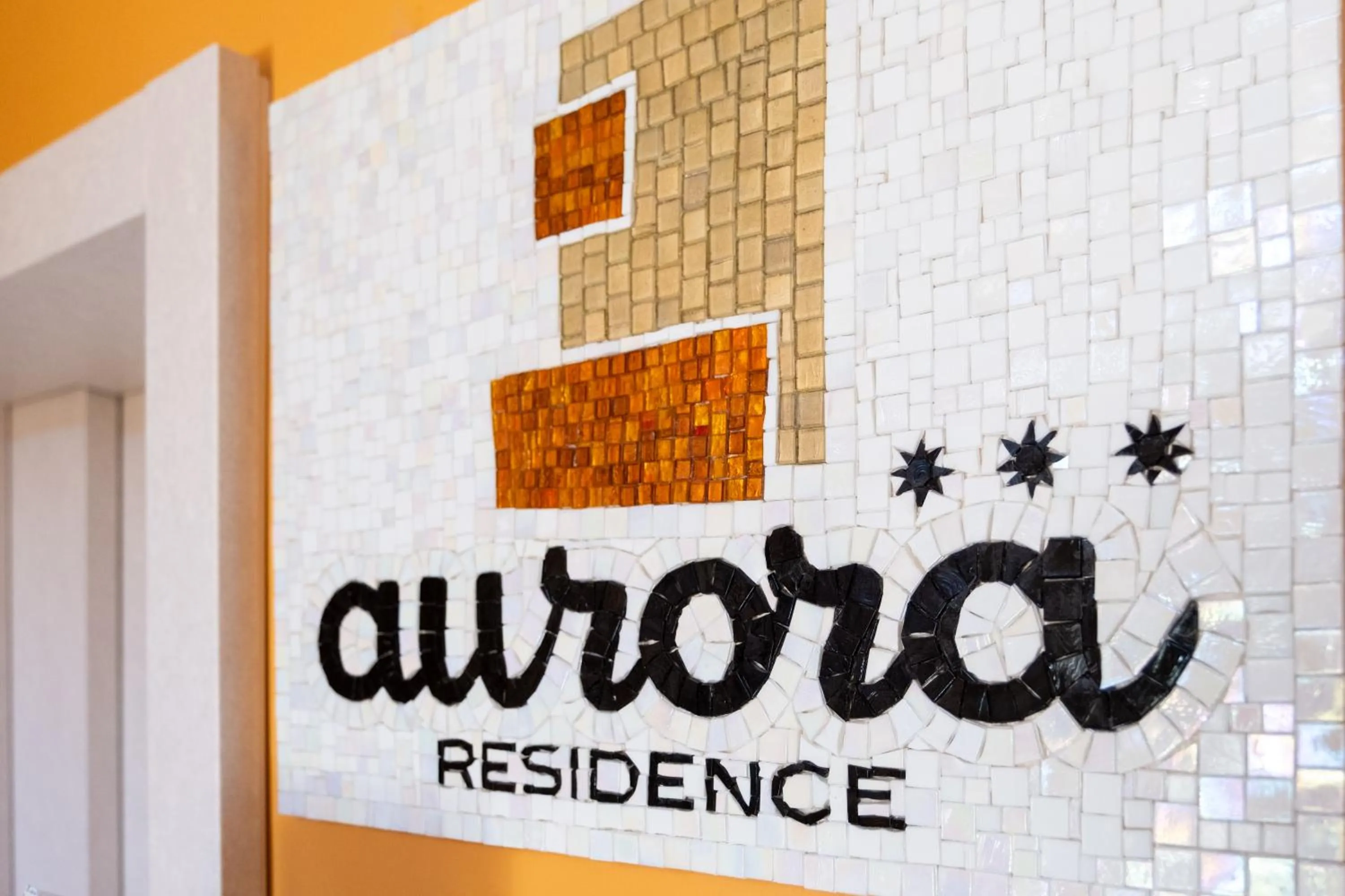 Property logo or sign in Aurora Residence