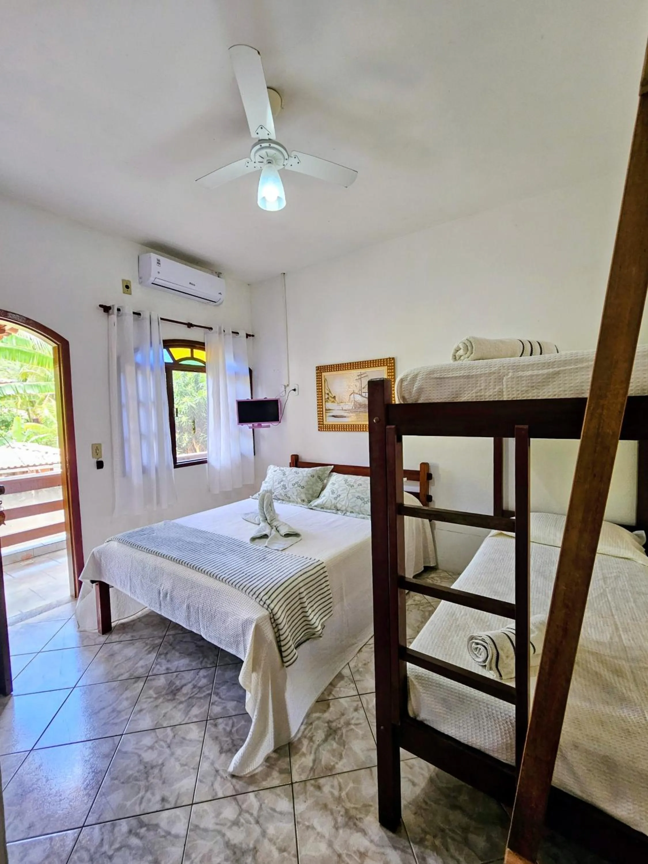 Bed in Pousada Recanto Das Emerências