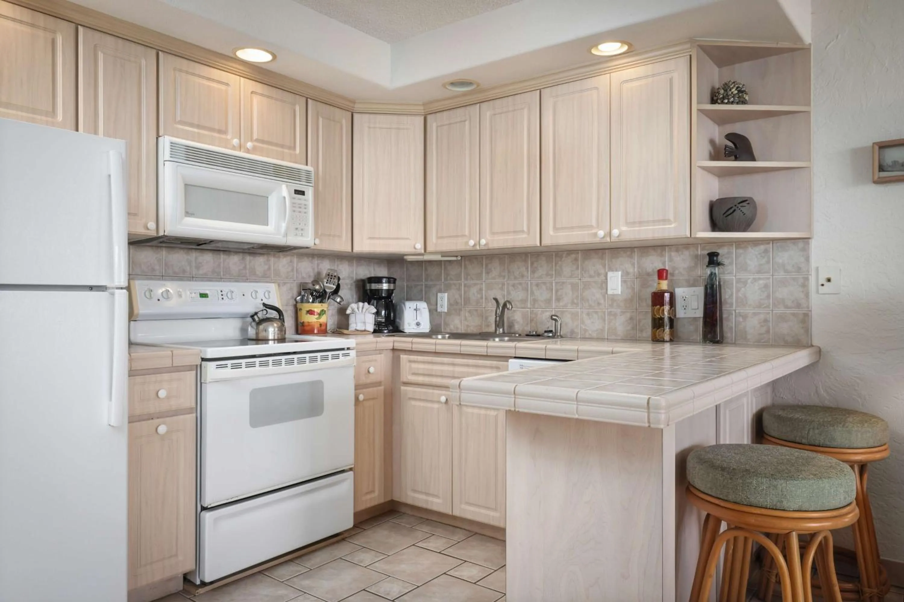 Kitchen or kitchenette in Aston at Papakea Resort