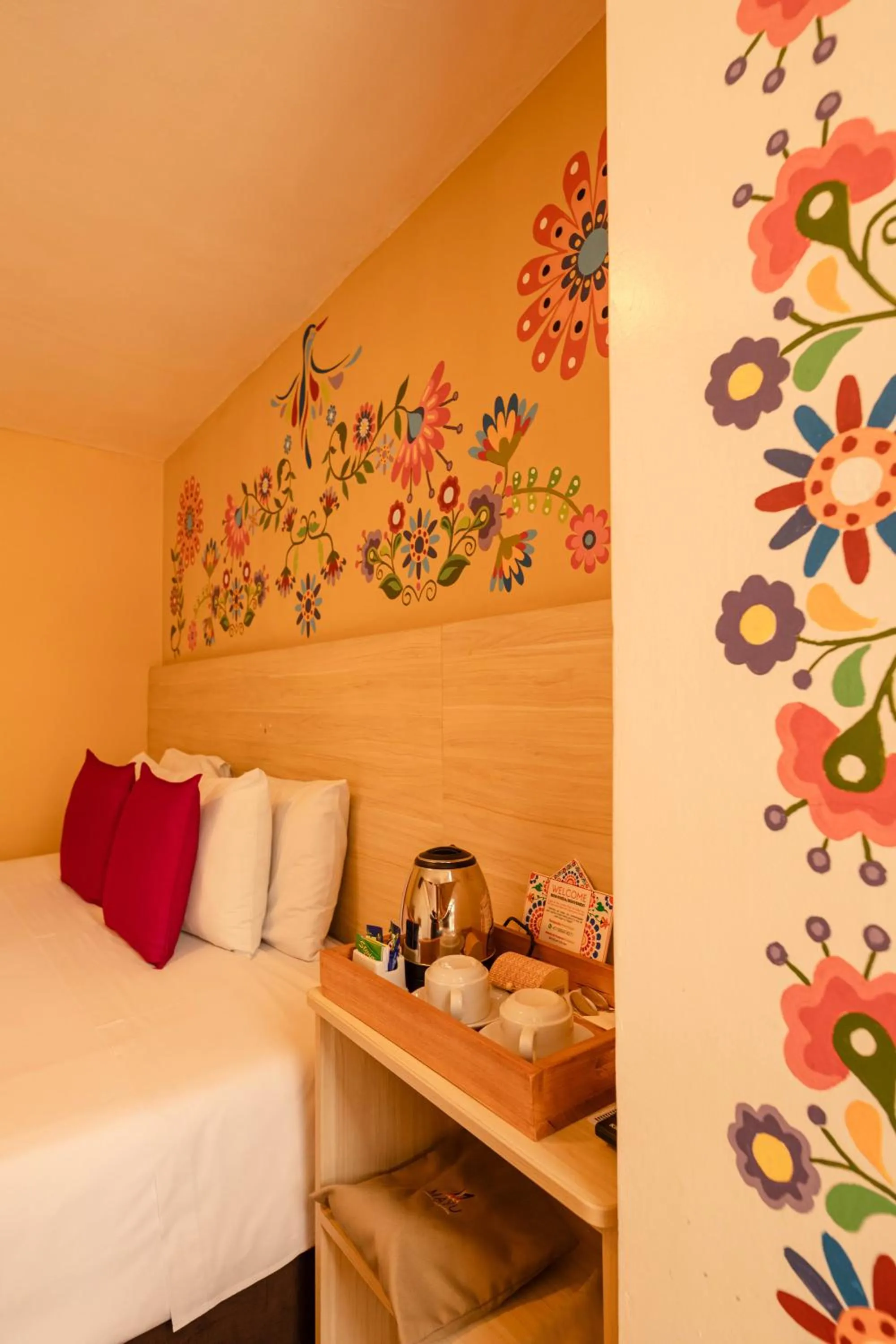 Bed in Mayu Boutique Hotel