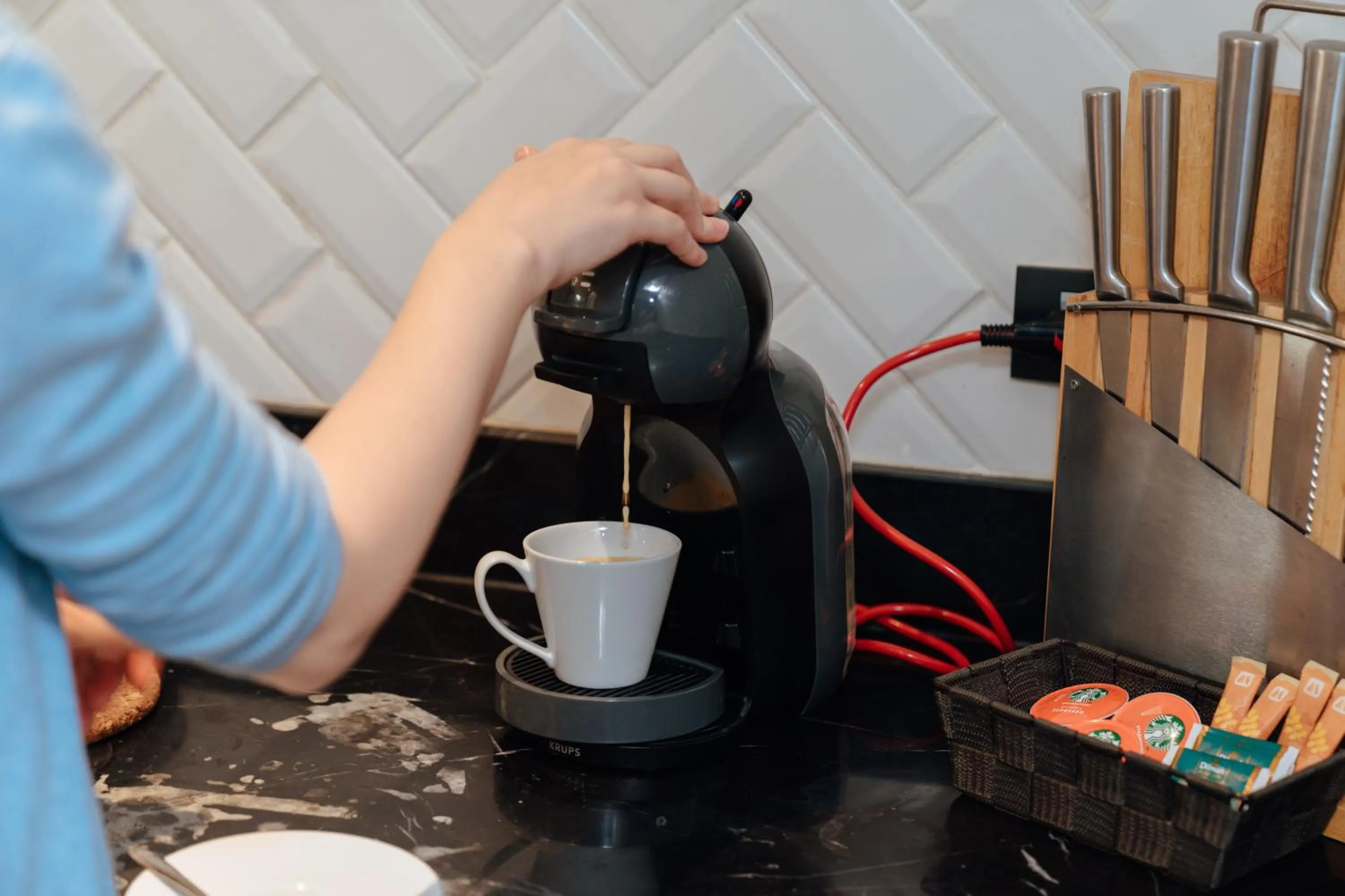 kitchen in THEA Private Suites by TH District