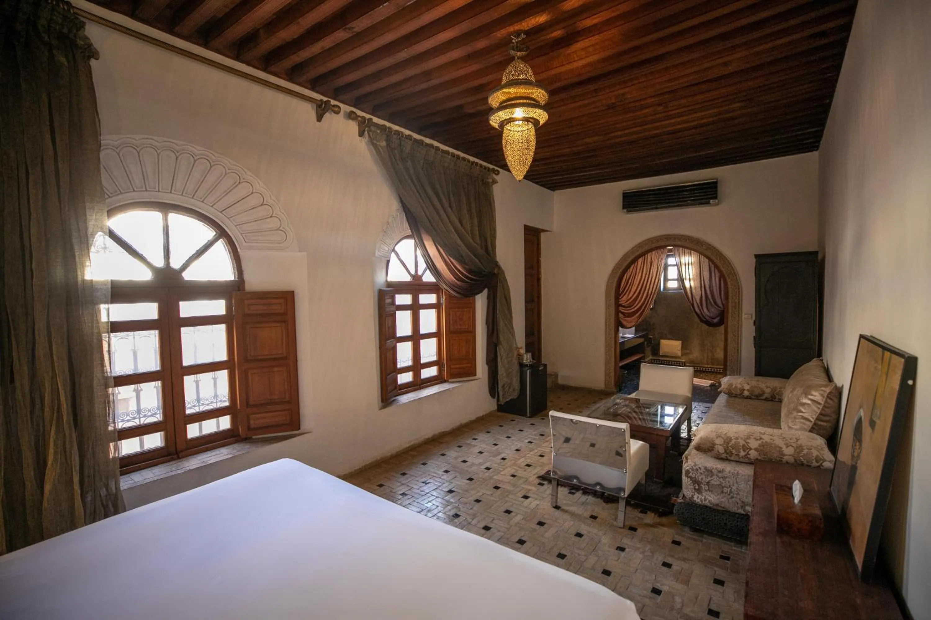 Living room, Bed in Riad Layla