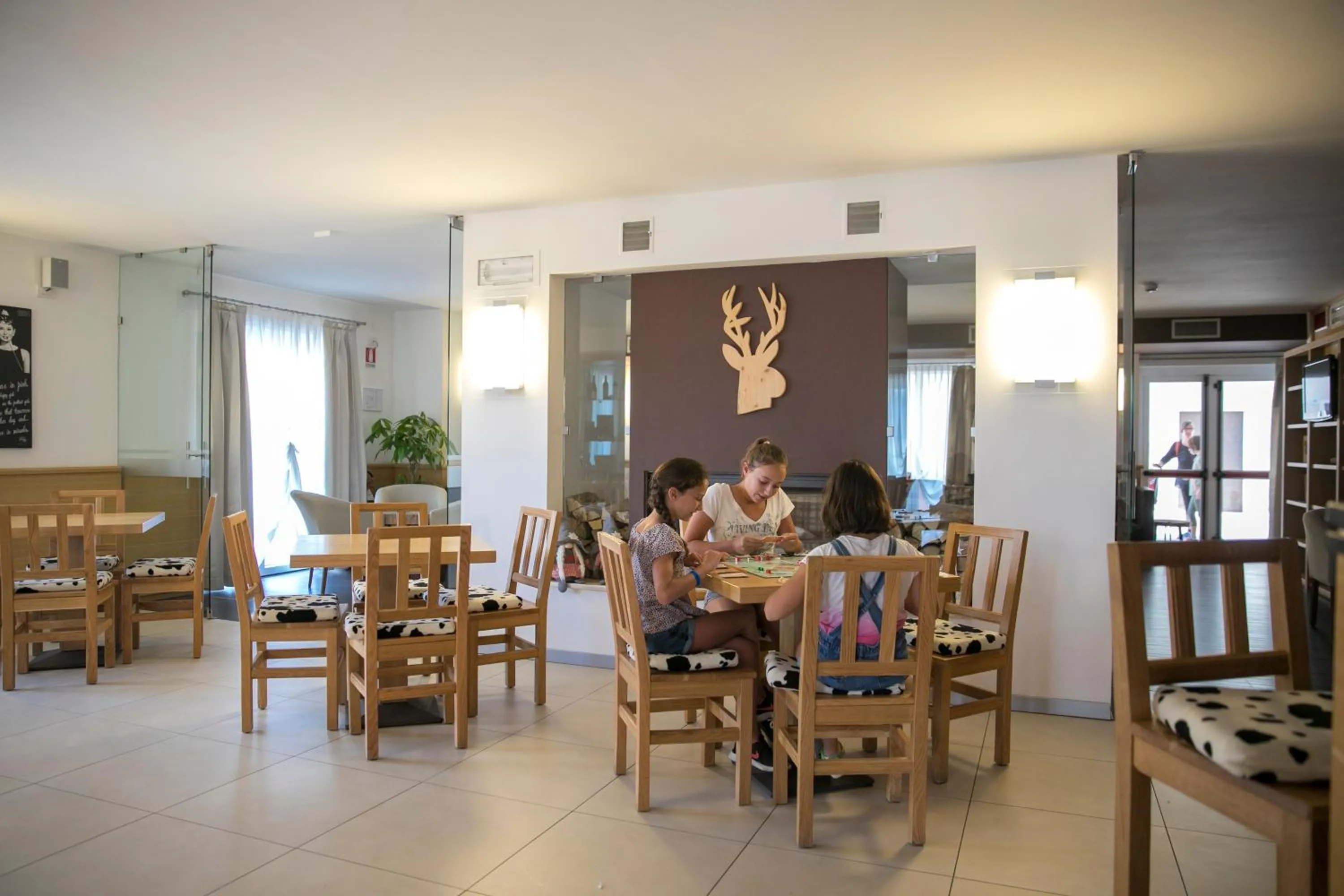 Communal lounge/ TV room in Hotel Luna Bianca Folgaria