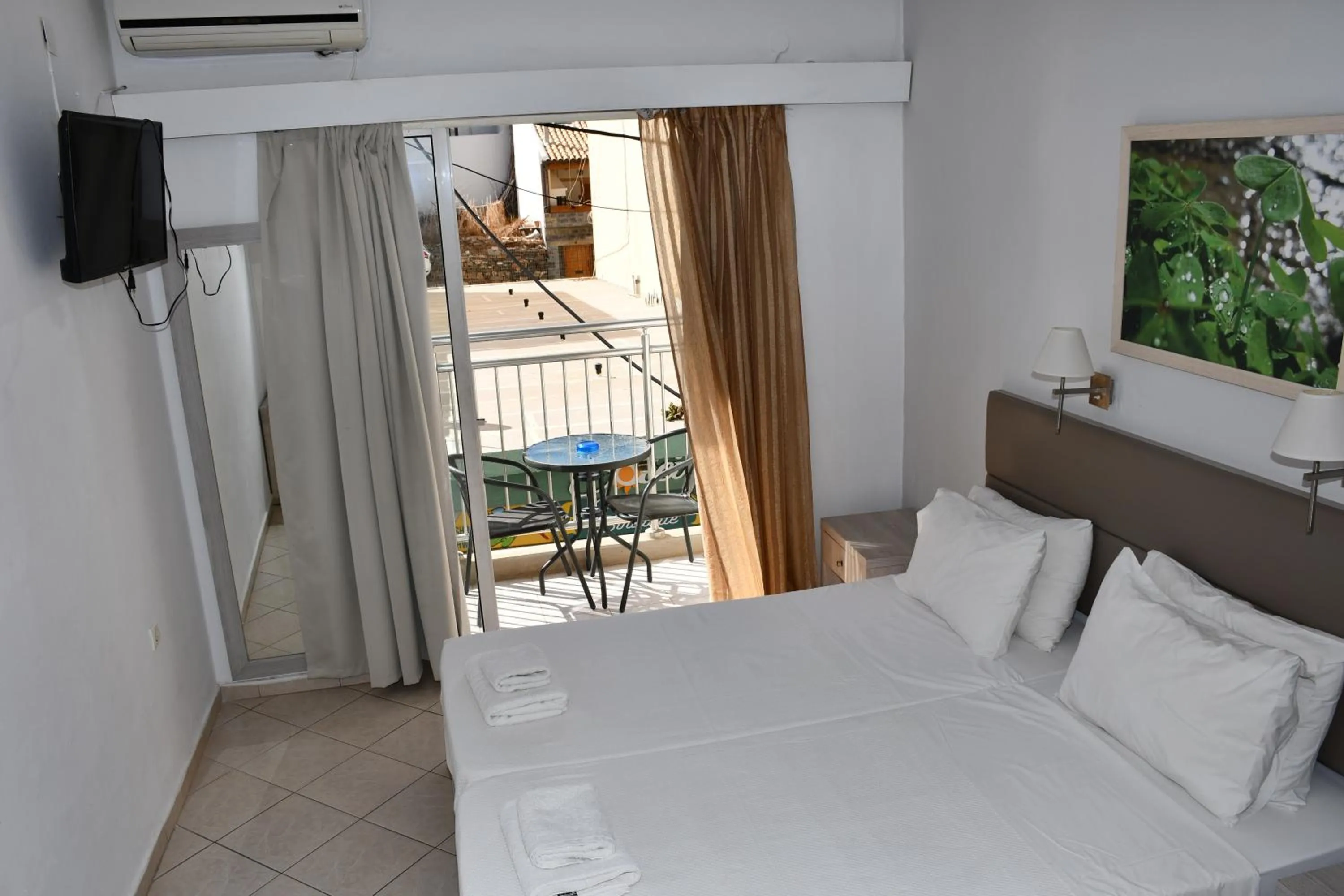 Bed in Aristea Hotel