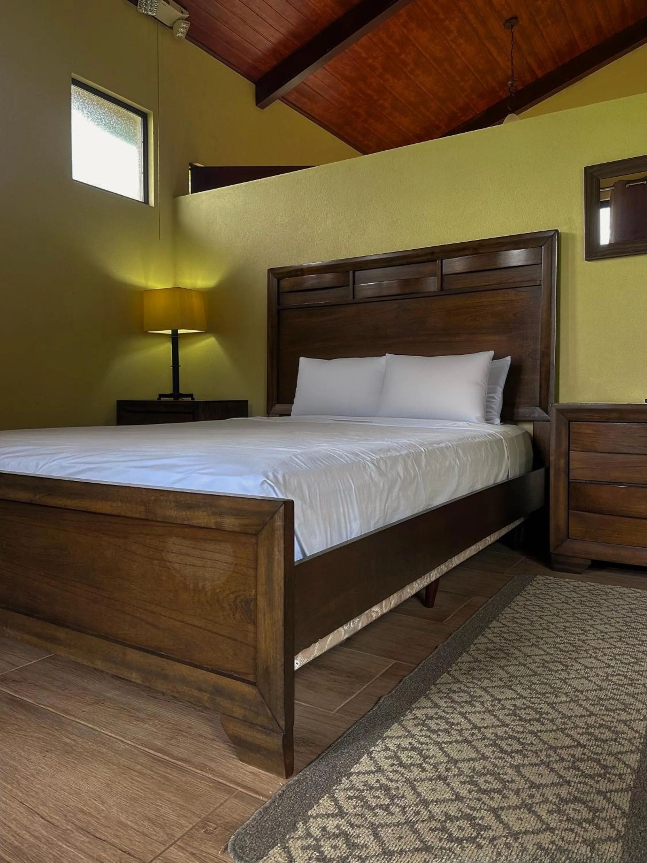 Bed in Arenal Roca Suites