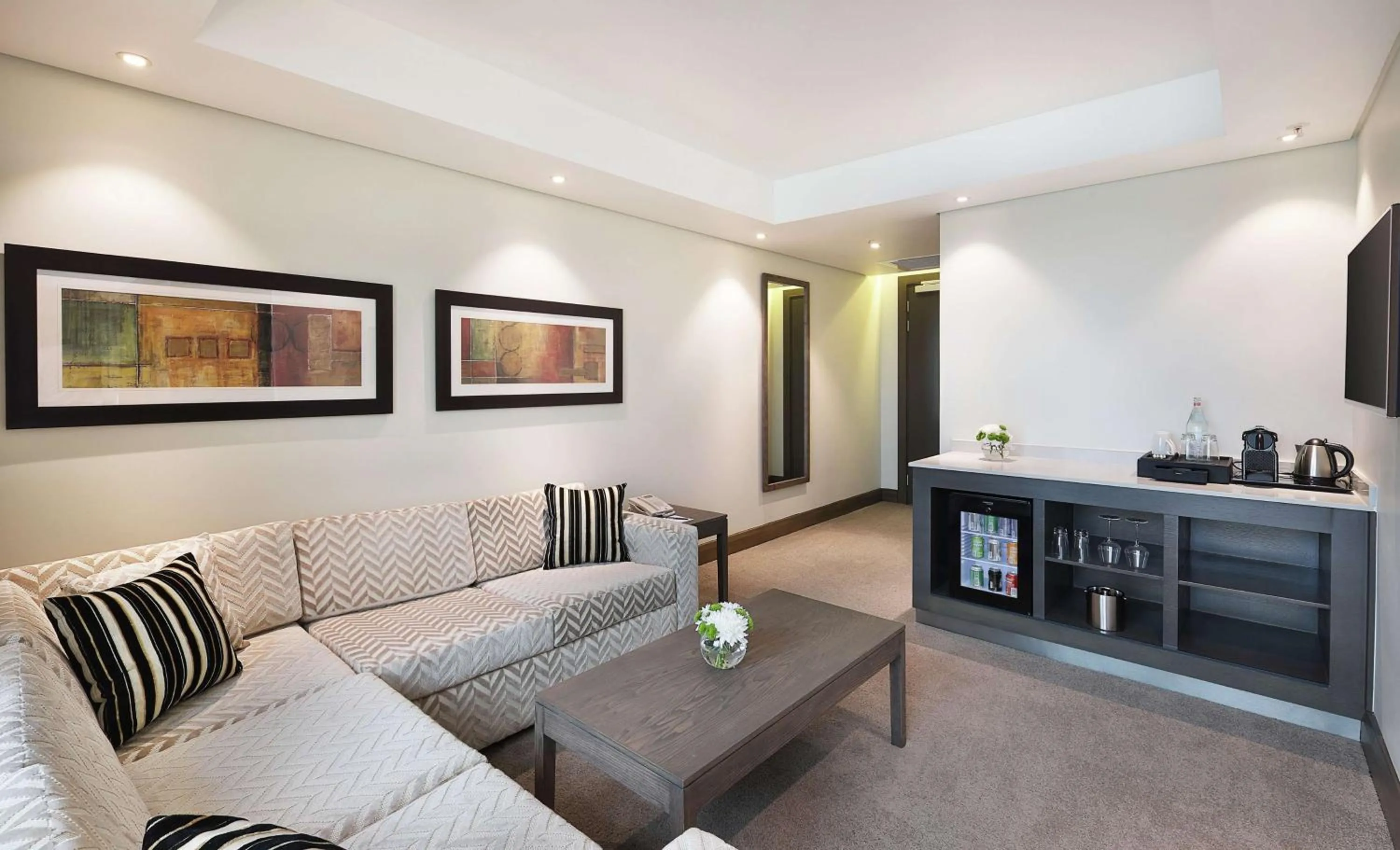 Living room in Legend Hotel Lagos Airport, Curio Collection By Hilton