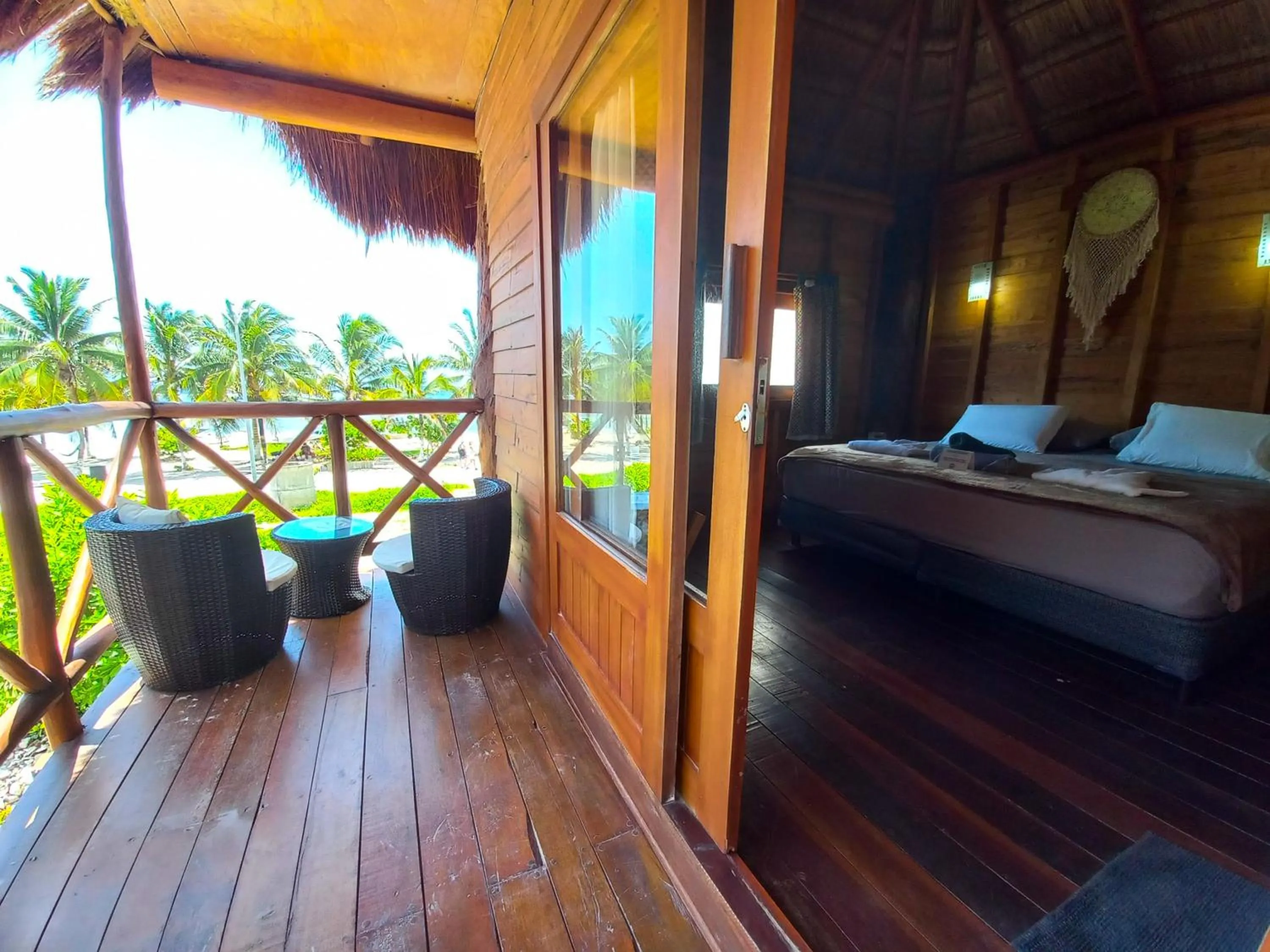 Balcony/Terrace, Bed in Palmeras de Mahahual Cabañas