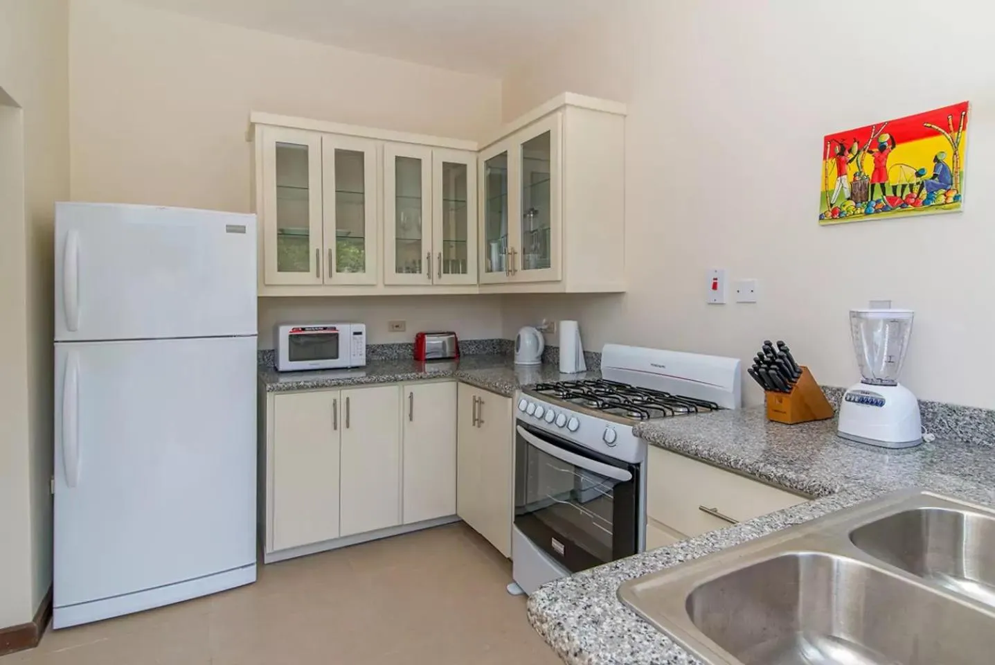 Kitchen or kitchenette in Luxury 2BR Home facing Beach w/Pool Montego Bay #4