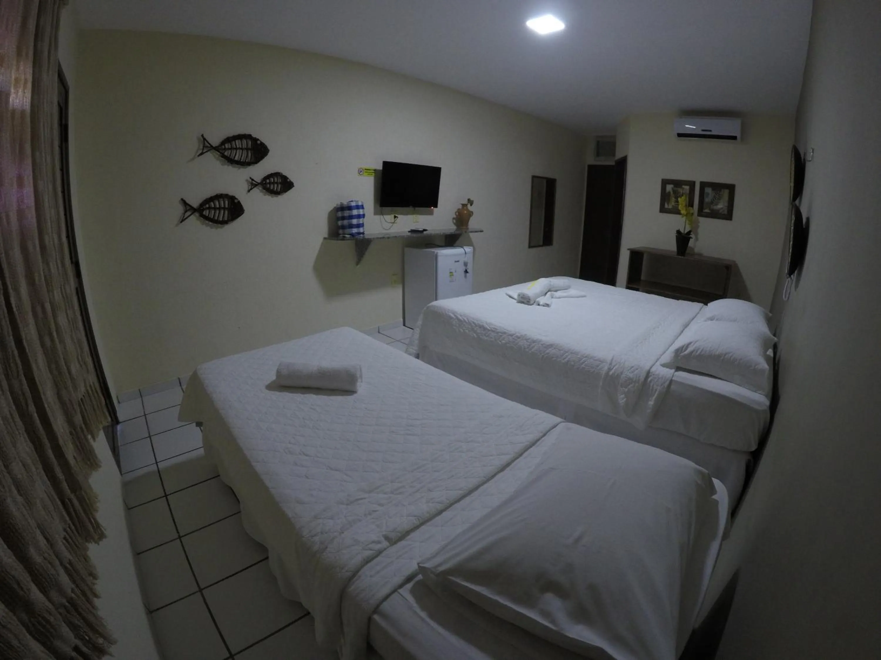 Bed in Pousada Enseada do Sol