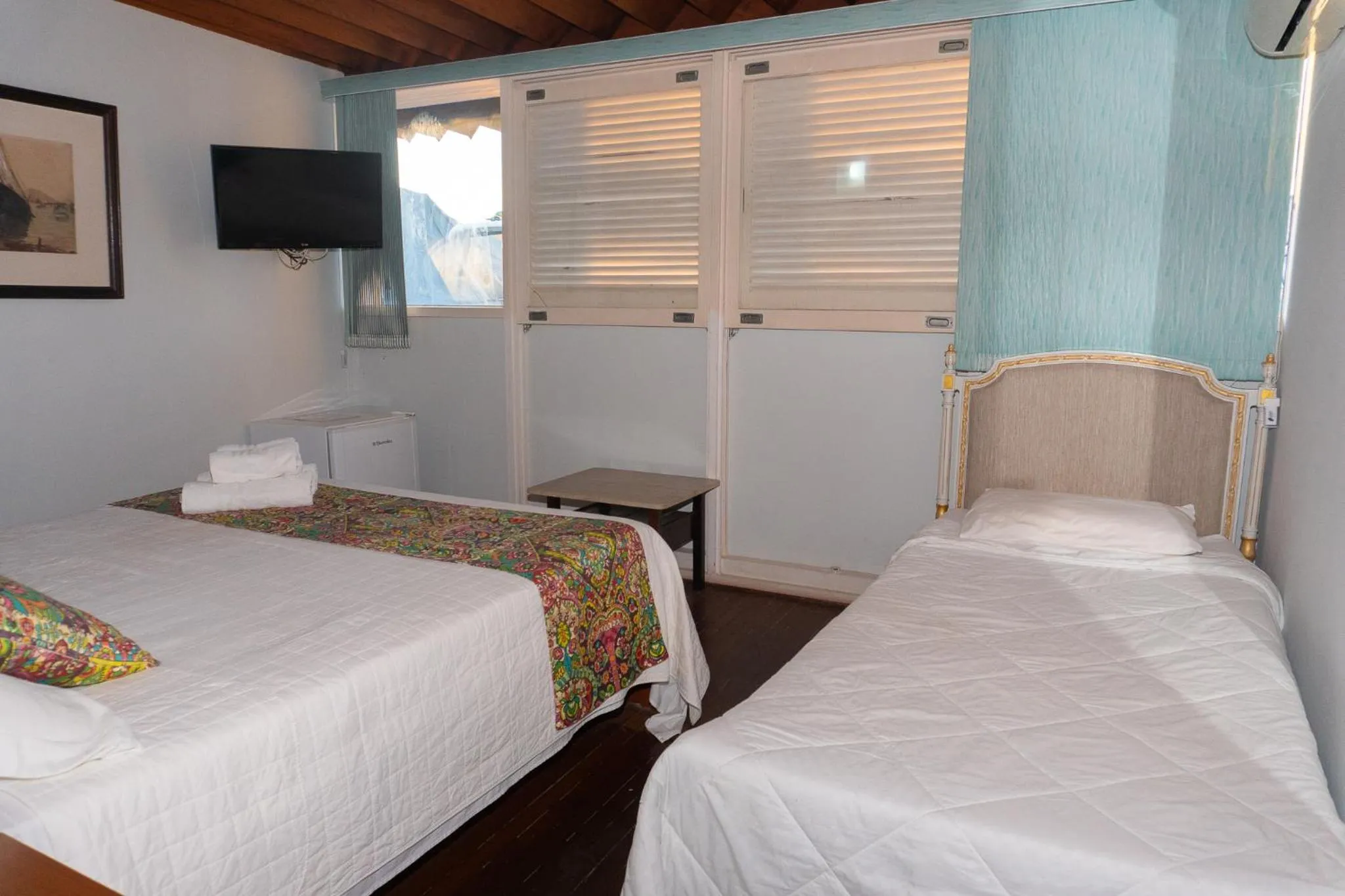 Bed in Pousada Marilia