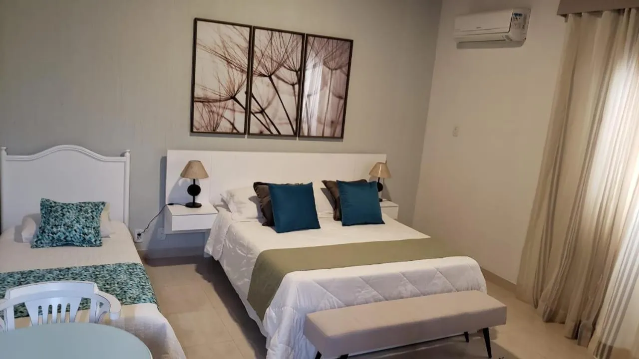 Bed in Pousada Marilia