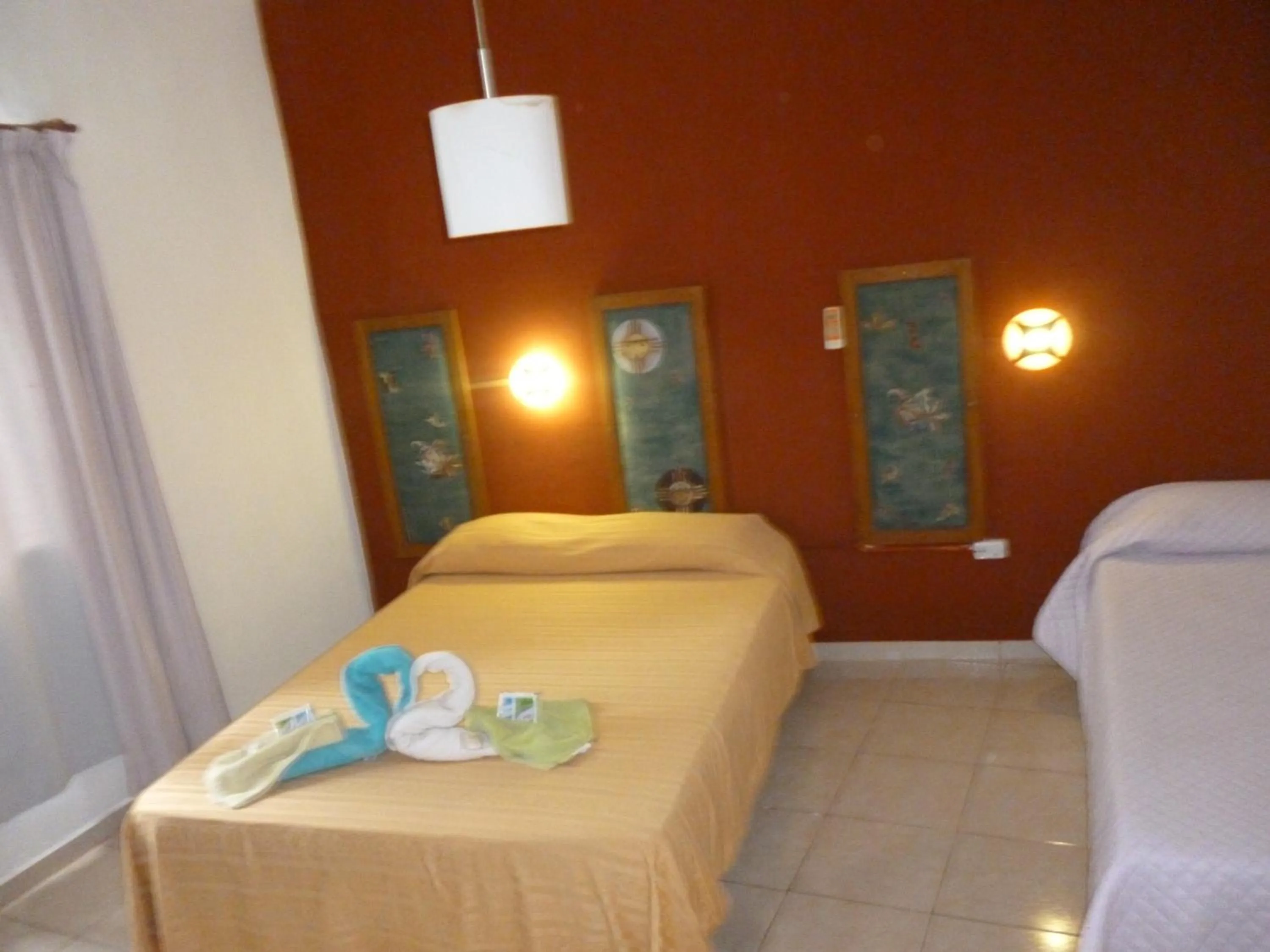 Bed in Petit Hotel Panambi