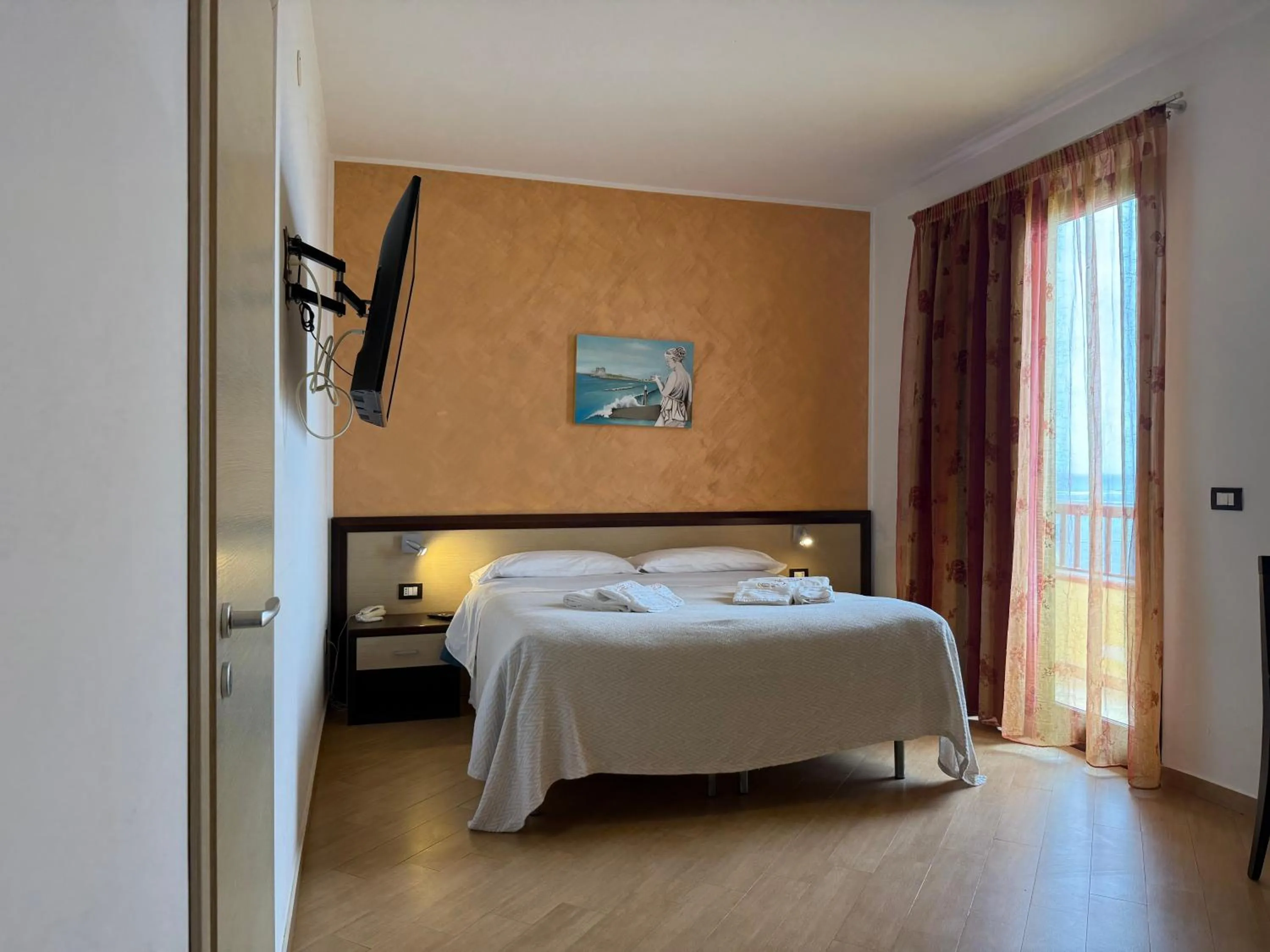 Bed in Albergo Perseo