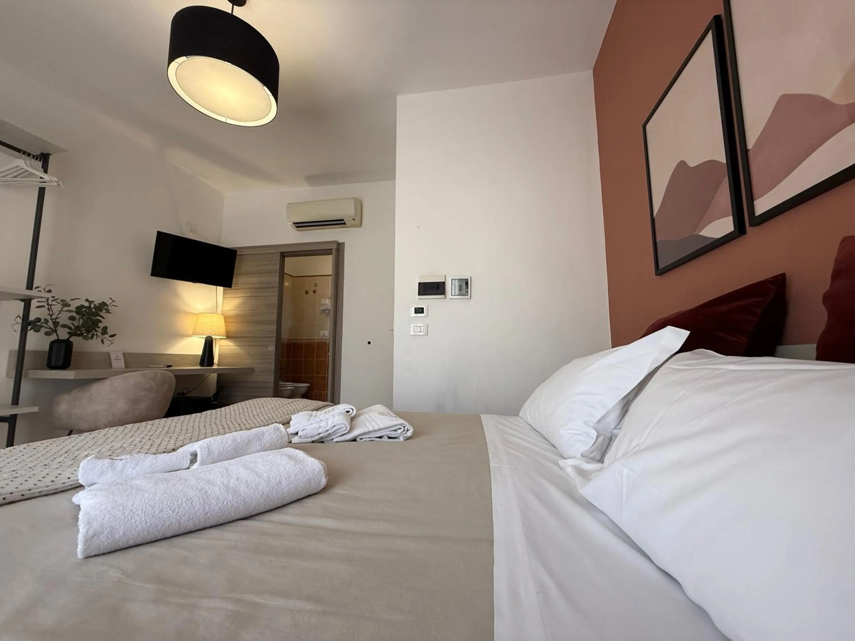 Bed in Albergo Perseo