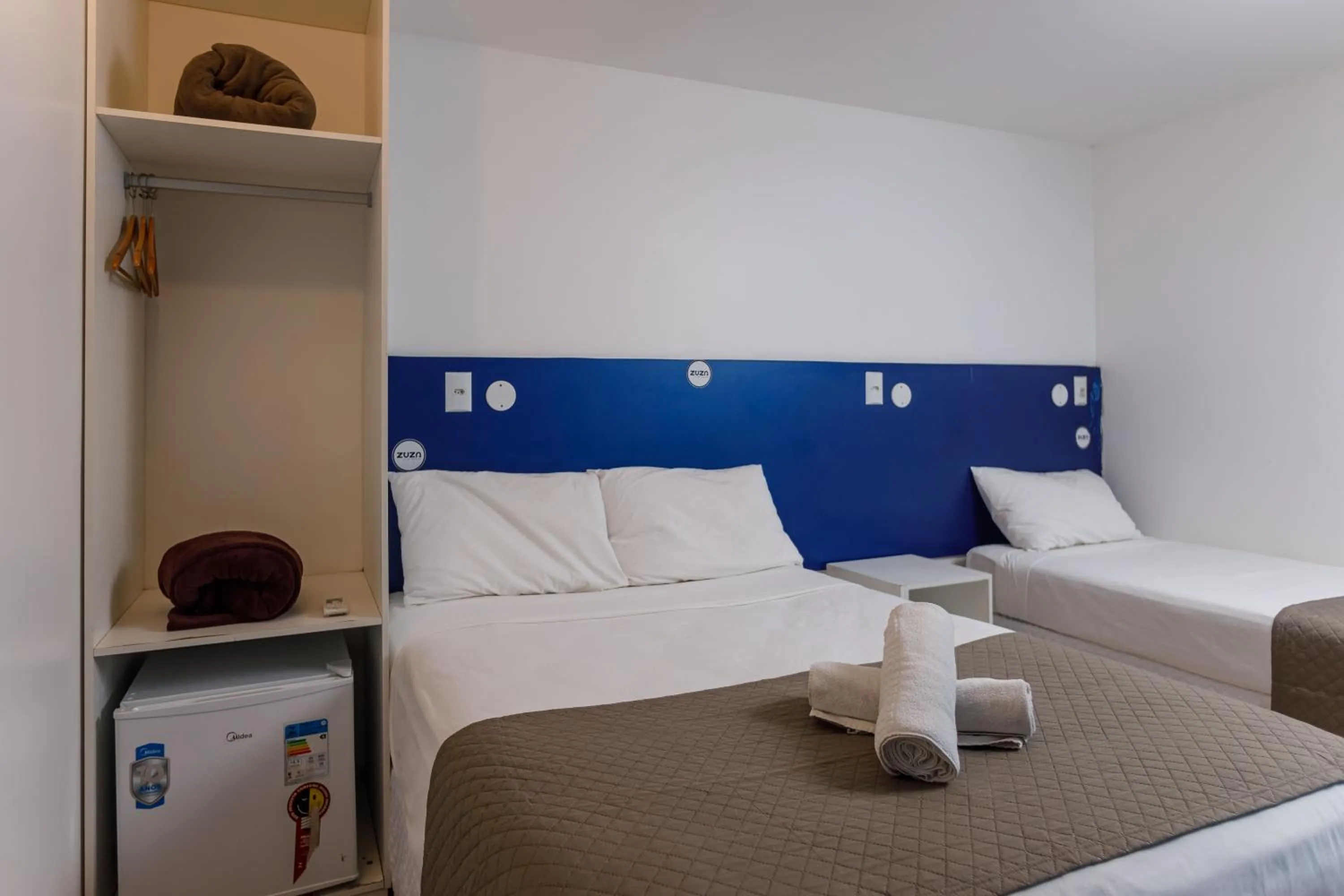 Bed in Zuza Slim Suítes