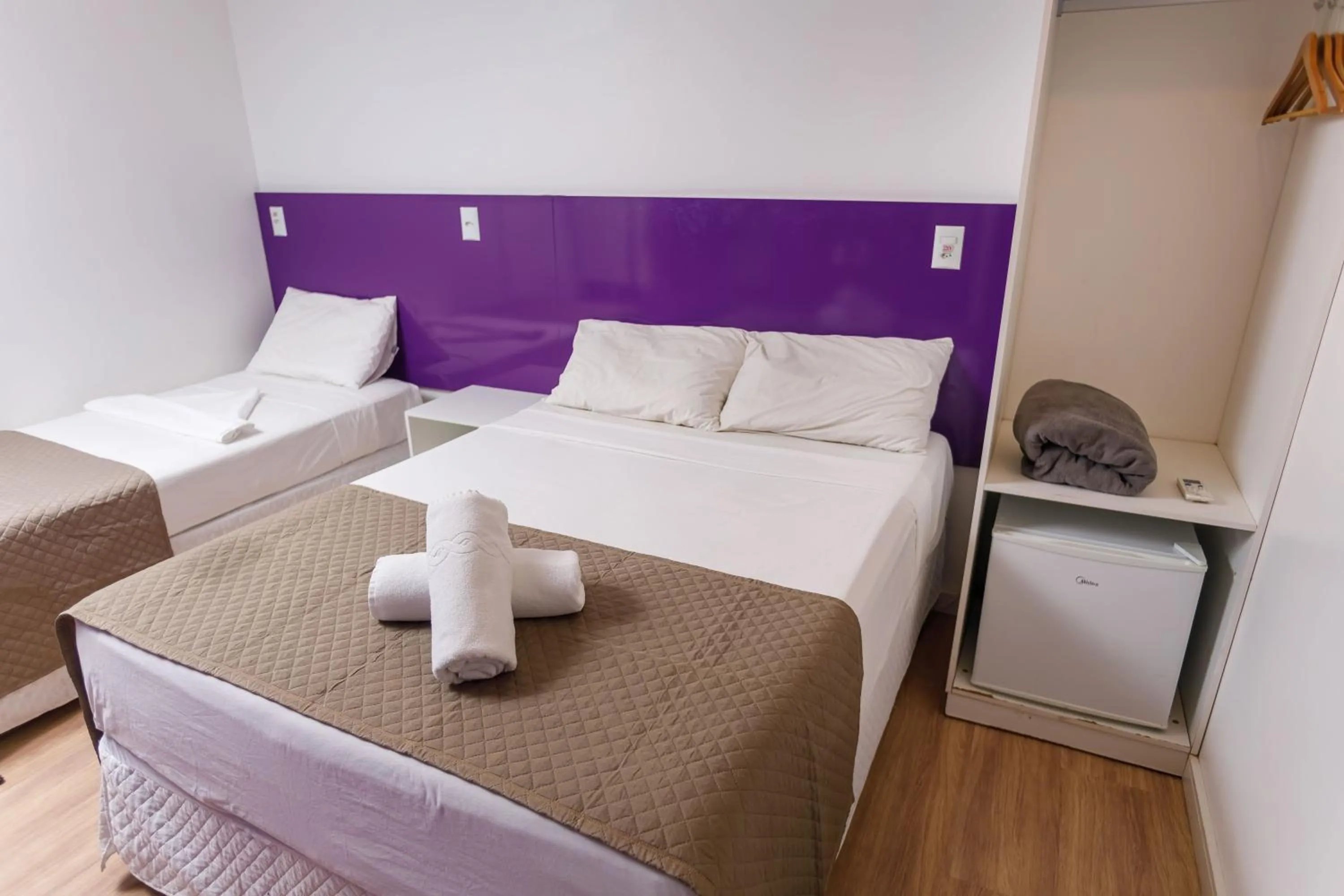 Bed in Zuza Slim Suítes