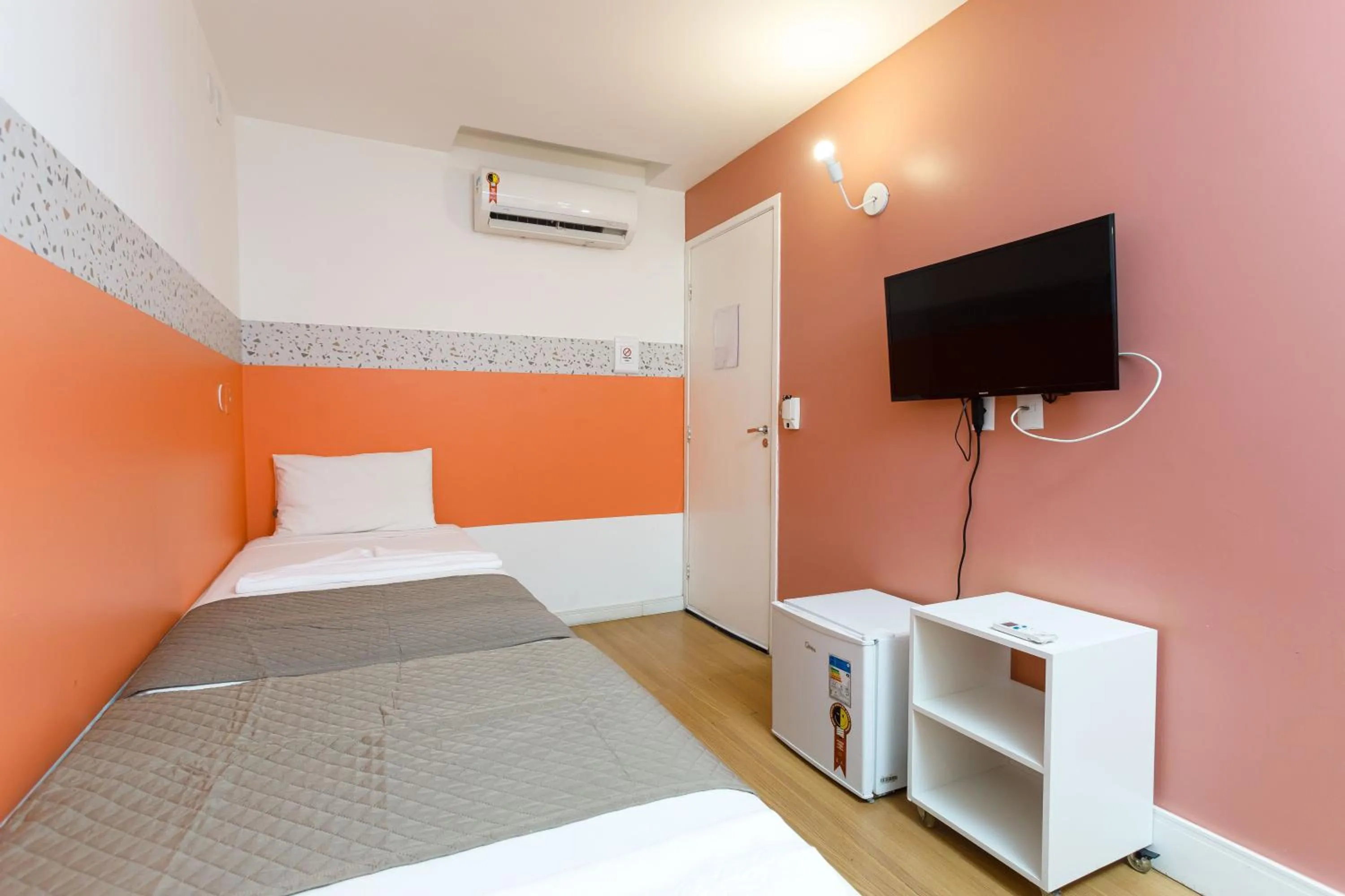 Bed in Zuza Slim Suítes