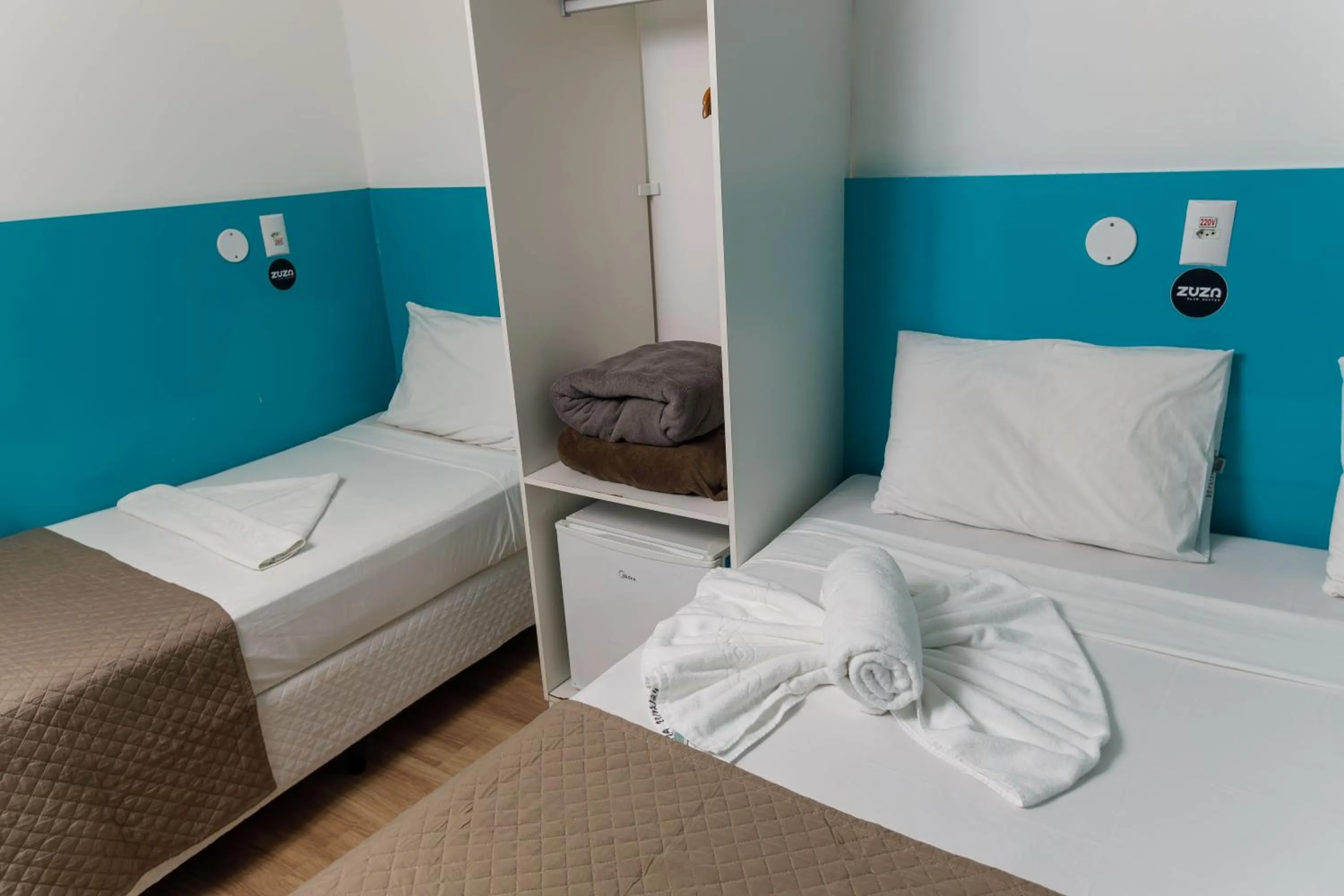 Bed in Zuza Slim Suítes