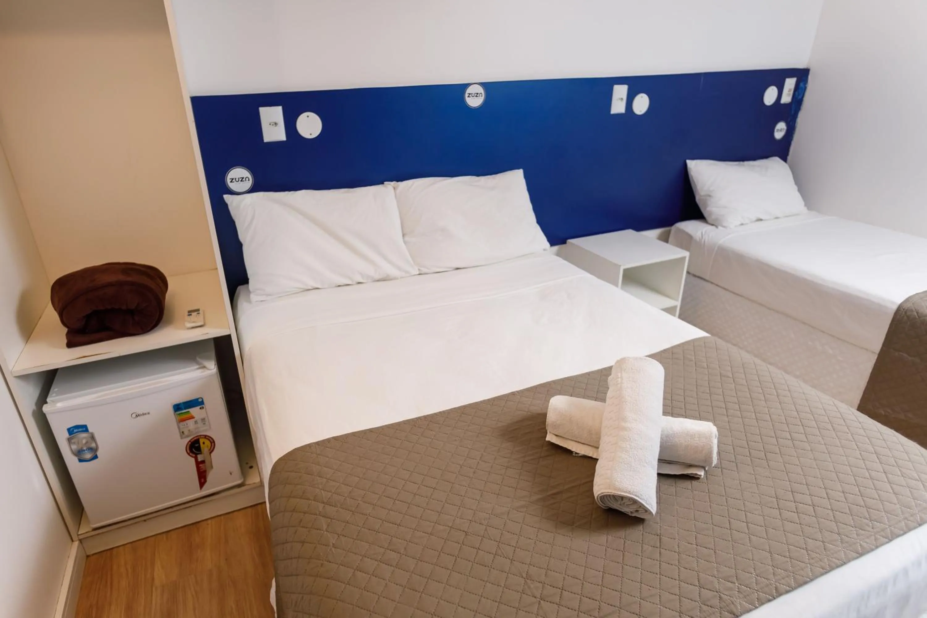 Bed in Zuza Slim Suítes