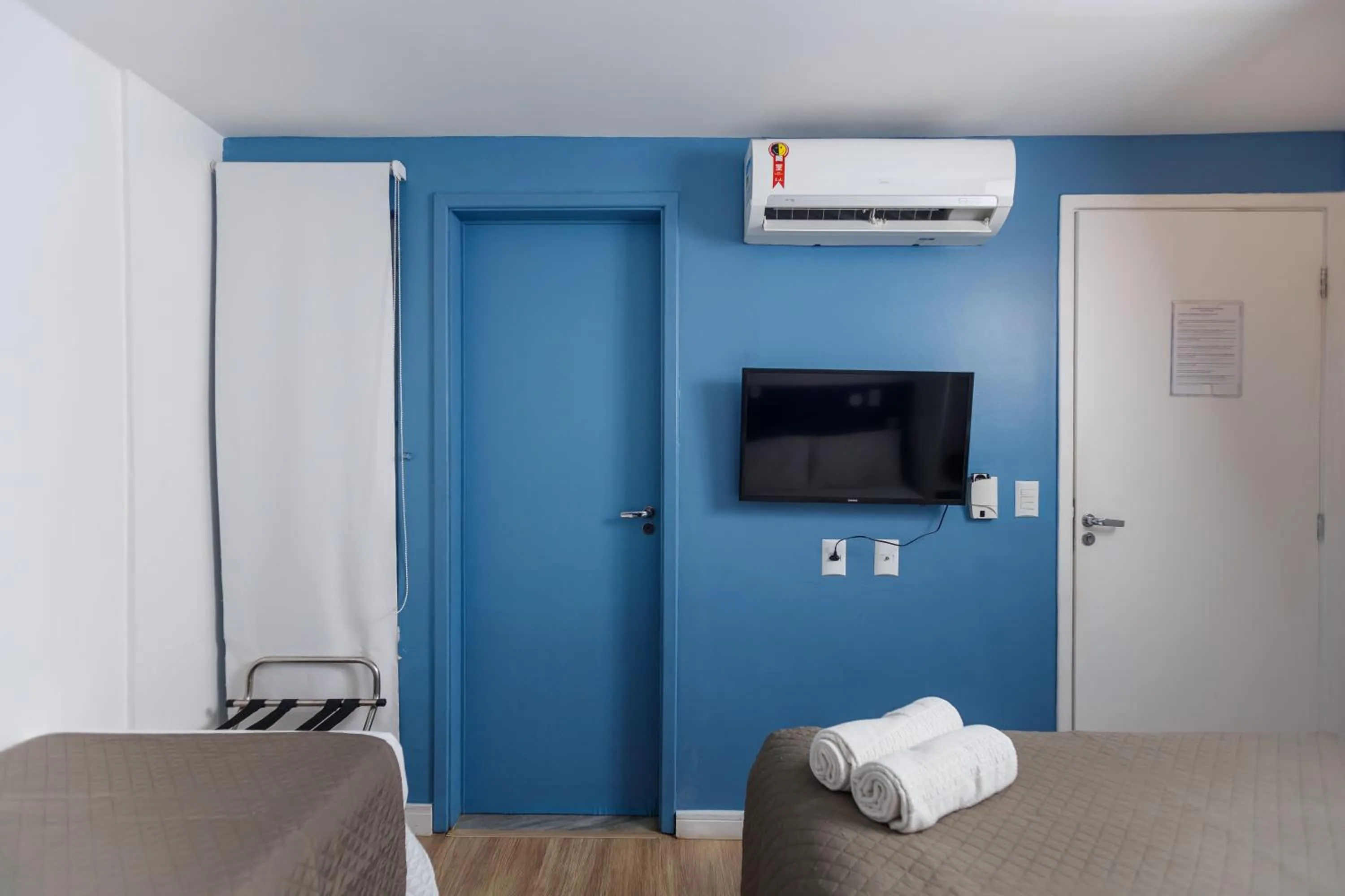 towels, Bed in Zuza Slim Suítes