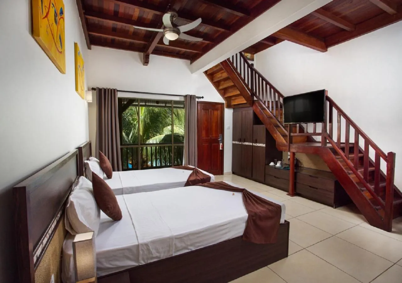 Photo of the whole room, Bed in Le Palmiste Resort & Spa