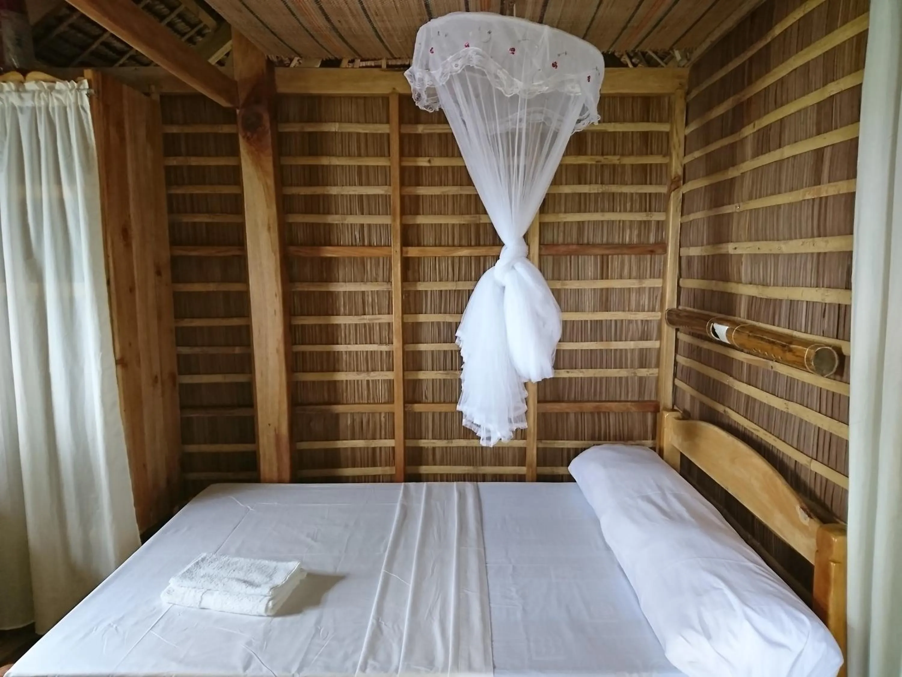 Bed in Tinaoog Beach Resort